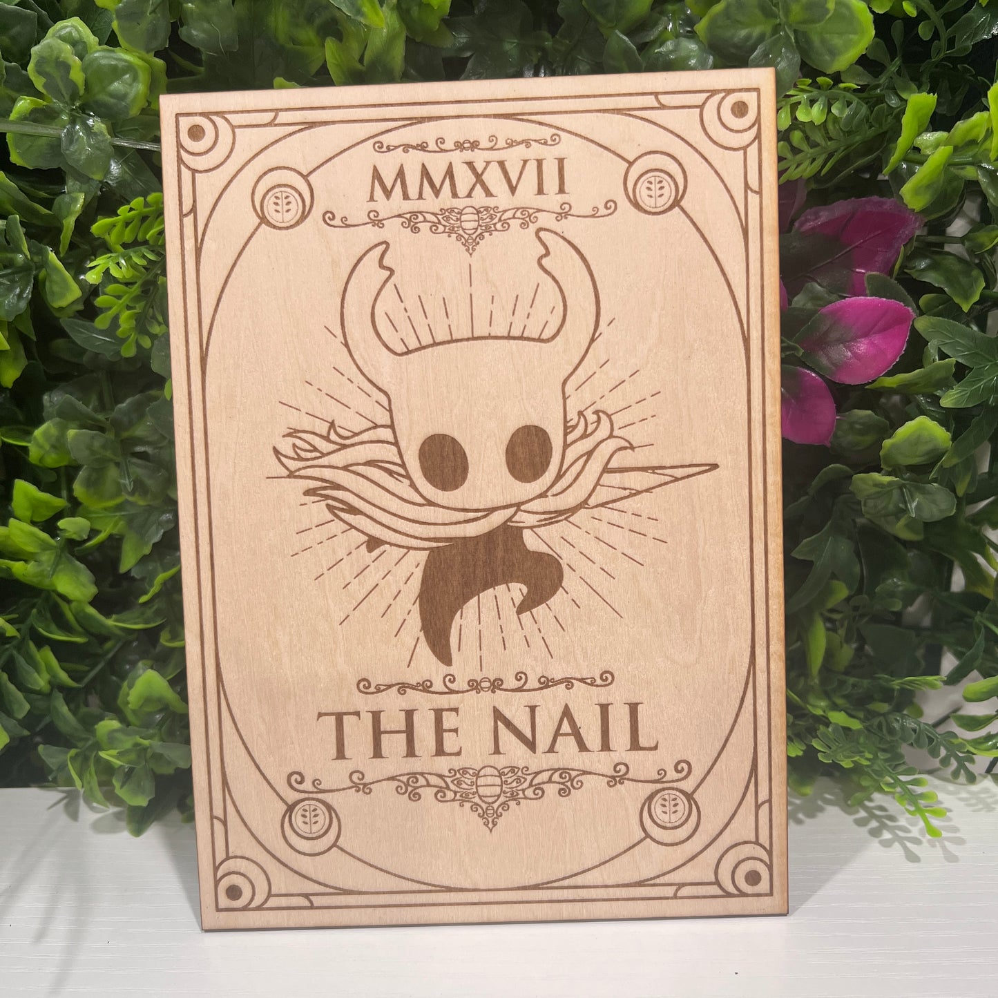 Set of two laser engraved wood tarot cards featuring Hollow Knight as The Nail and Hornet as the Needle. Unique indie game fan art collectible.