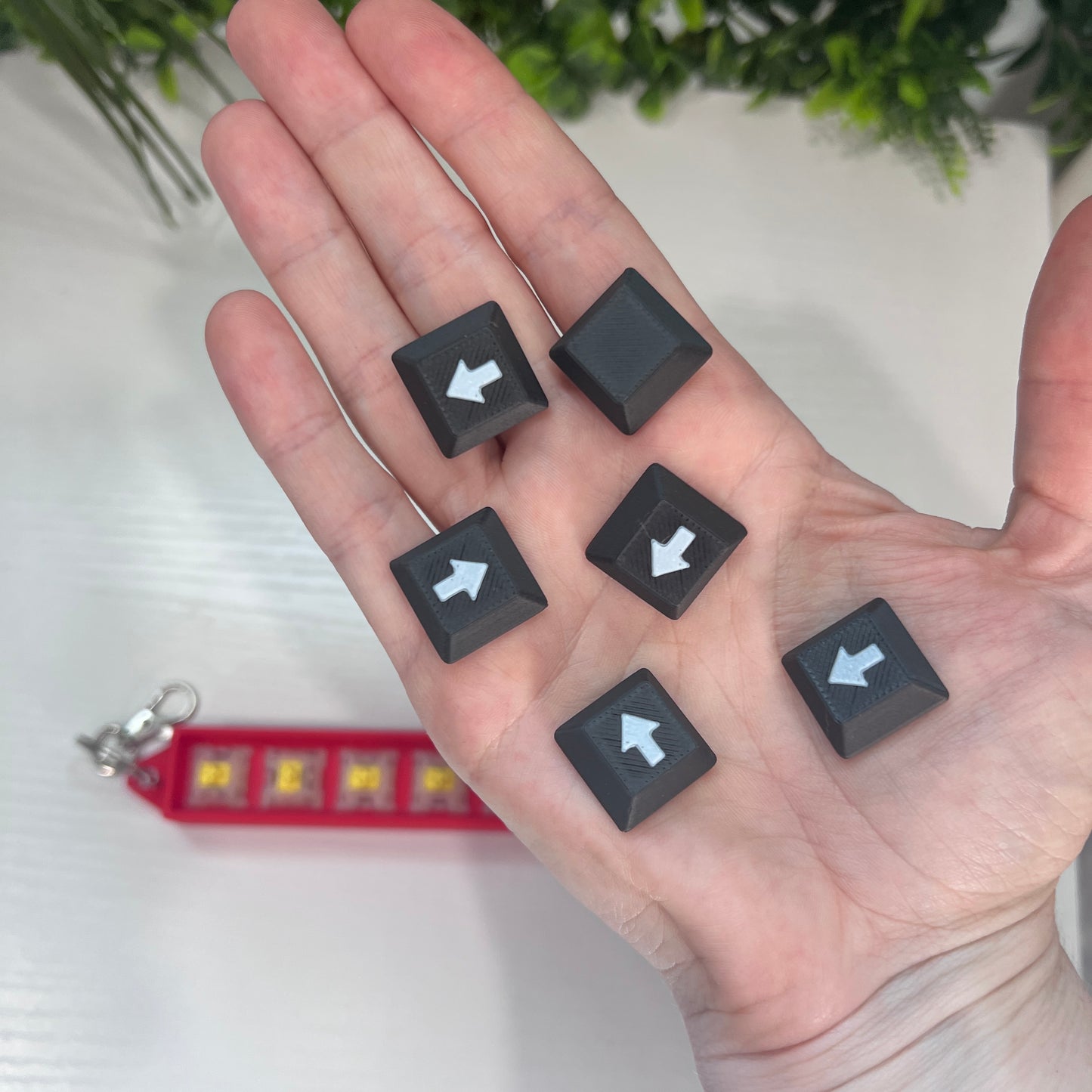 Helldivers 2-inspired keychain clicker featuring mechanical arrow keys. A perfect fidget toy for gamers, stress relief, and tactical clicking action.
