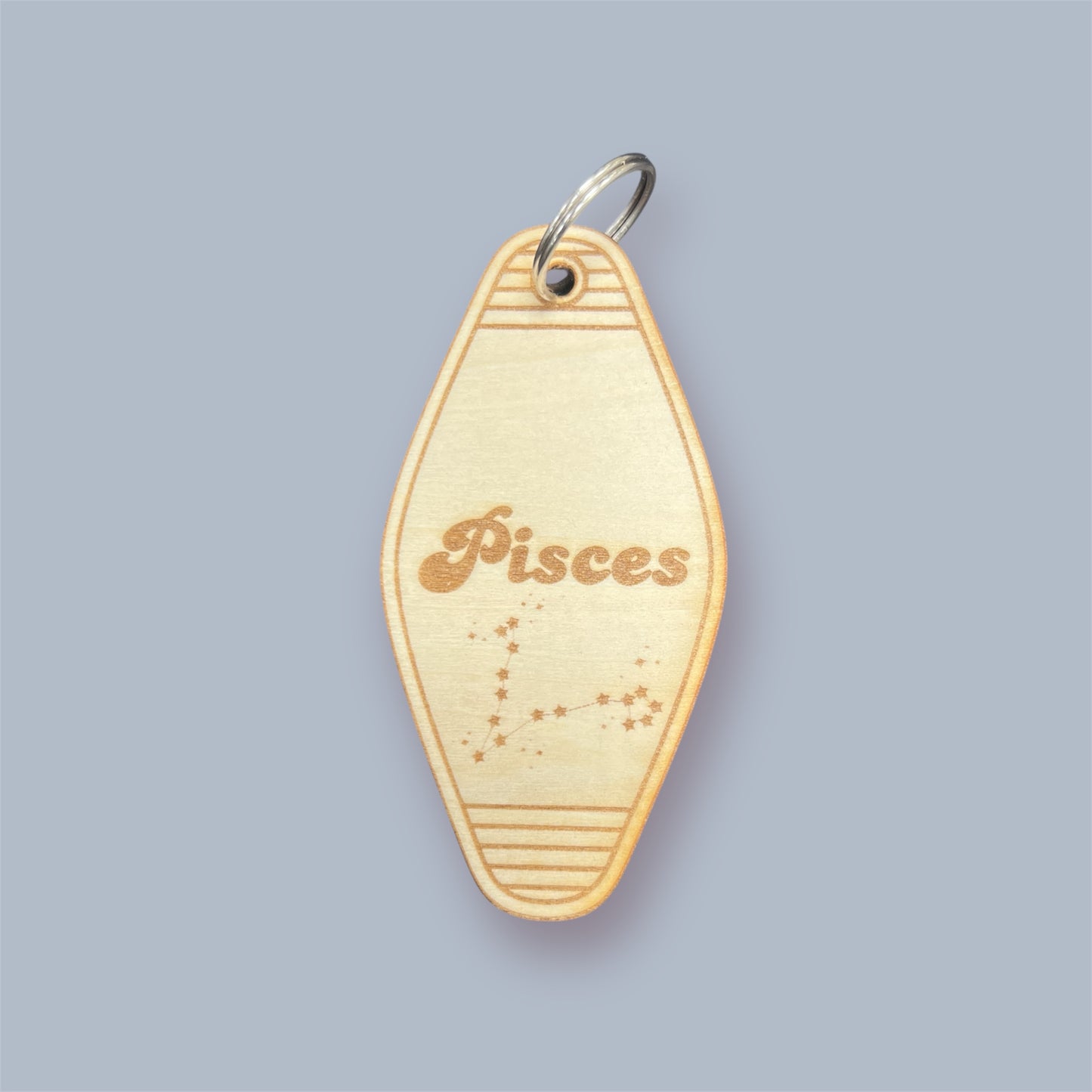 Laser engraved wood motel keychain featuring zodiac names and constellations, perfect for astrology lovers, horoscope fans, and retro gift collectors. This is for the Zodiac sign Pisces.