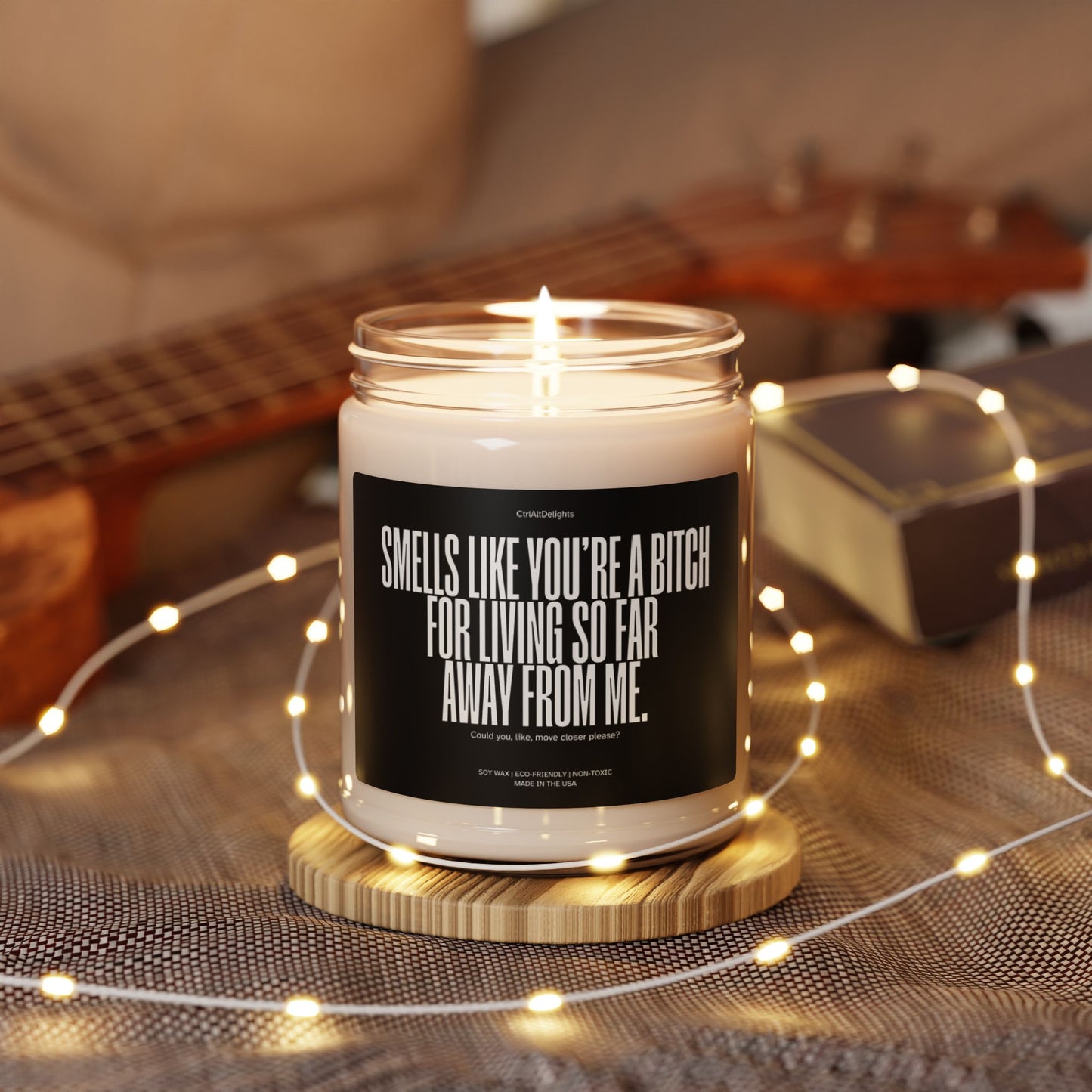 This eco-friendly soy candle features a bold, funny message for long-distance friends: Smells like you’re a bitch for living so far away from me. Perfect sarcastic gift to bring humor and fun to any space.