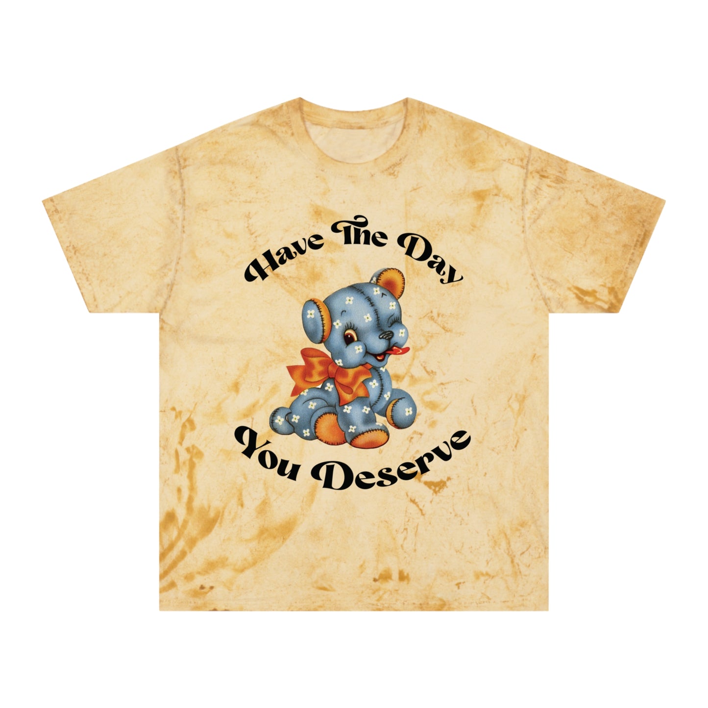 T-shirt with a cute plush bear design in shades of blue, wearing a red bow, accompanied by the playful phrase, Have the Day You Deserve. Casual and relaxed fit for an effortlessly cool look. Available in Blue, Gray, and Citrine.