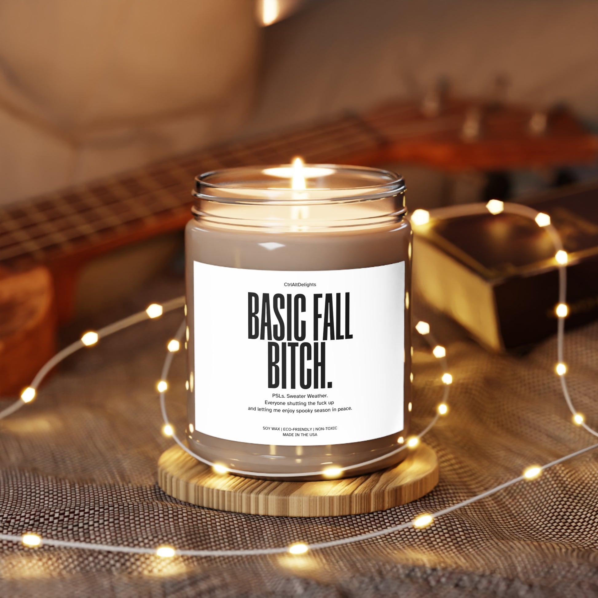 Basic Fall Bitch soy wax candle, featuring a funny and bold label perfect for autumn vibes. The candle boasts eco-friendly and non-toxic ingredients, making it a great gift for PSL lovers and those enjoying cozy fall vibes.