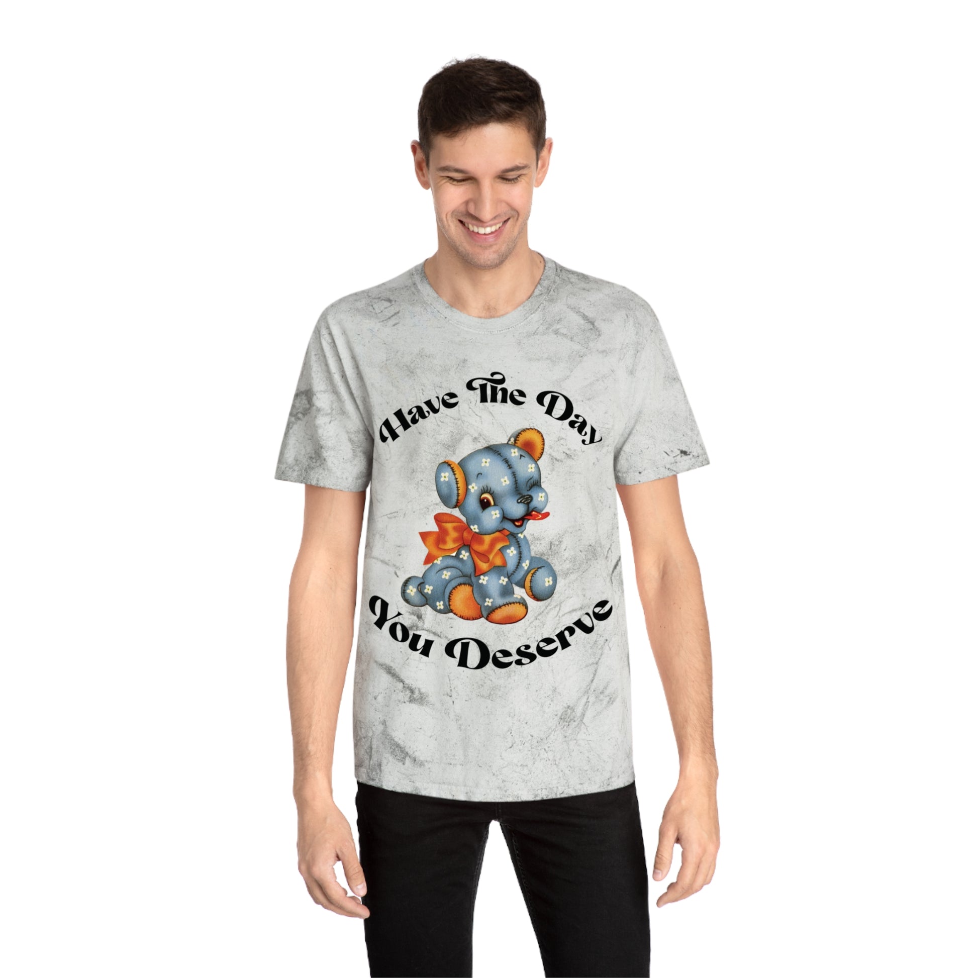 T-shirt with a cute plush bear design in shades of blue, wearing a red bow, accompanied by the playful phrase, Have the Day You Deserve. Casual and relaxed fit for an effortlessly cool look. Available in Blue, Gray, and Citrine.