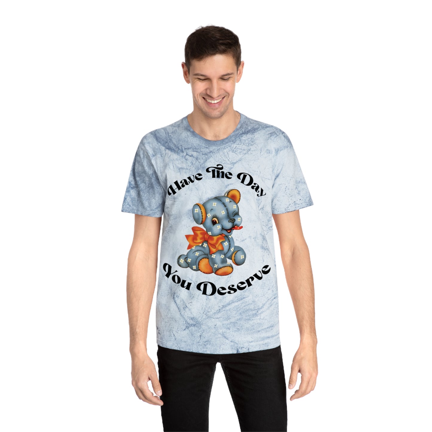 T-shirt with a cute plush bear design in shades of blue, wearing a red bow, accompanied by the playful phrase, Have the Day You Deserve. Casual and relaxed fit for an effortlessly cool look. Available in Blue, Gray, and Citrine.