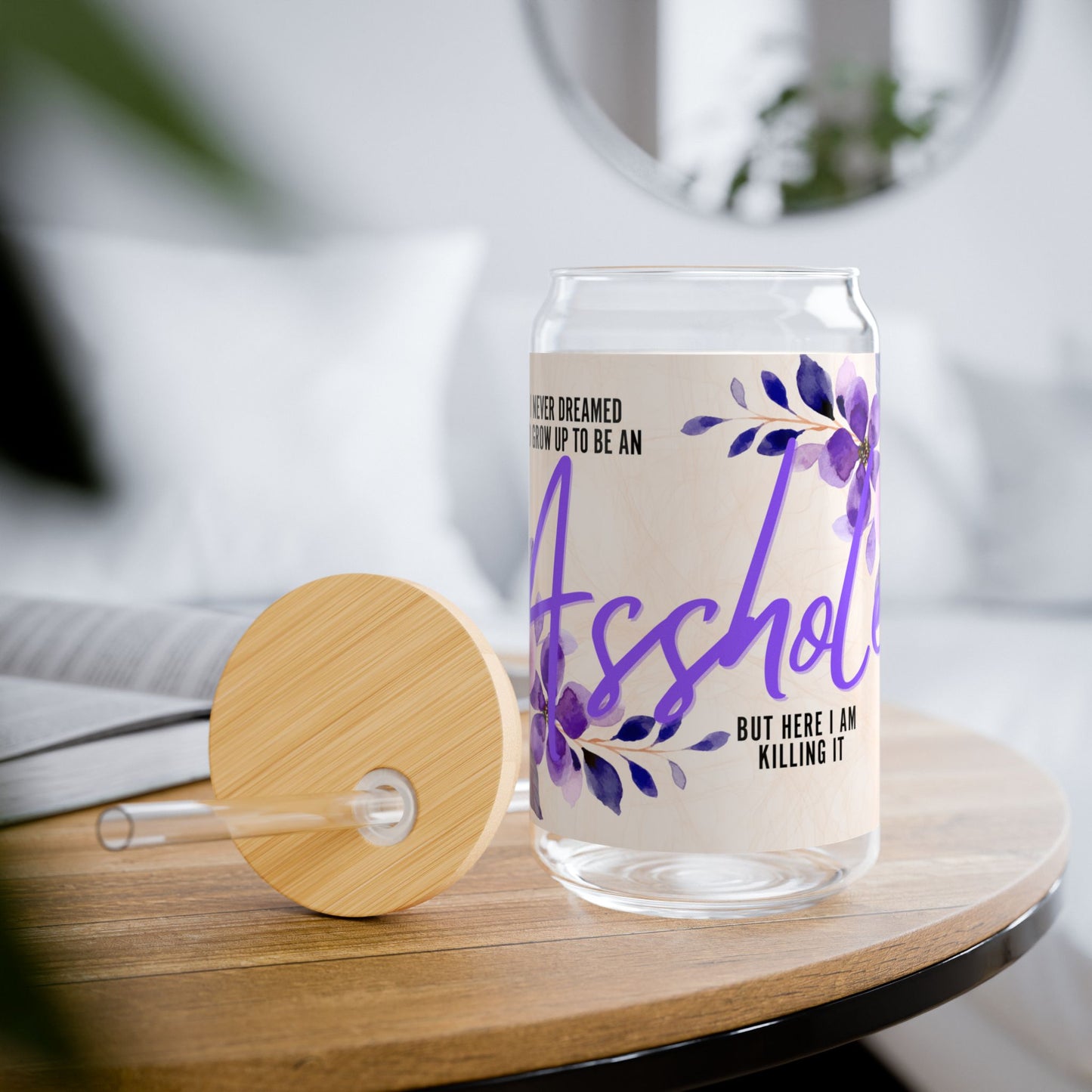 Glass tumbler with bamboo lid and straw featuring the quote 'I Never Dreamed I’d Grow Up to Be an Asshole.' Perfect funny gift for sarcastic friends or as a unique addition to your drinkware collection.