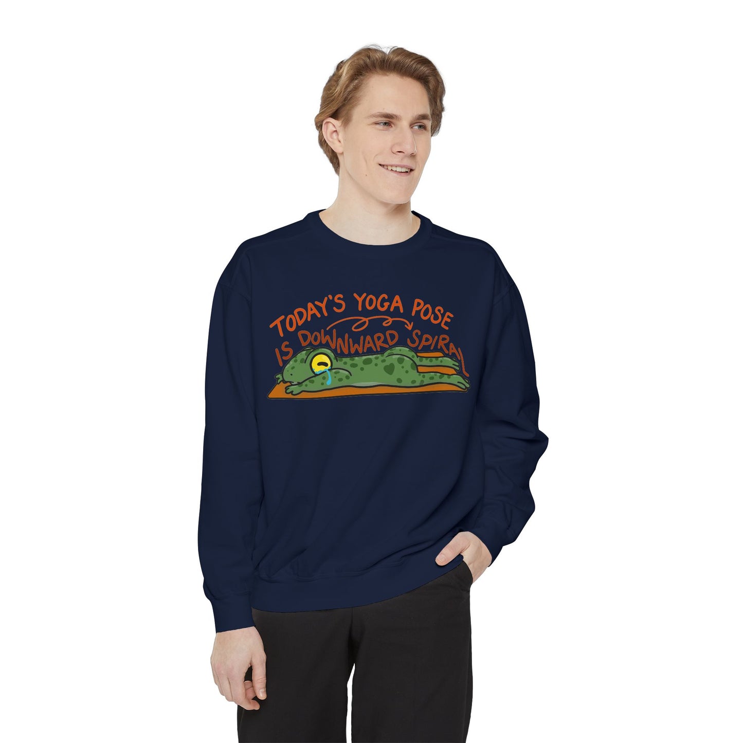 This sweatshirt features a cute, exhausted frog in a yoga pose with the text "Today's Yoga Pose is Downward Spiral." Perfect for yoga enthusiasts and those with a sense of humor.