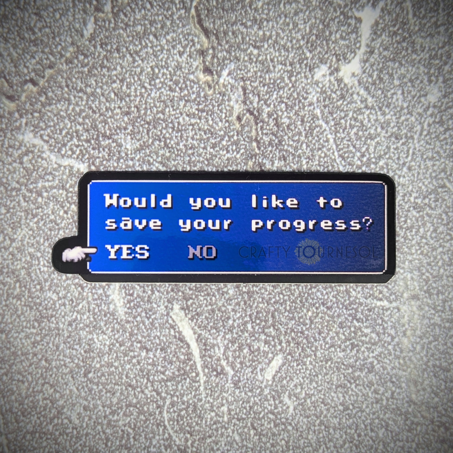 "Pixel art sticker featuring a classic RPG-style save prompt with the text 'Would you like to save your progress? YES NO,' ideal for gamers and nostalgia lovers. Background is a textured gray surface."