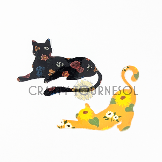 "Set of two floral cat silhouette stickers: one black with vintage roses and one yellow with sunflowers. Perfect for cat lovers and fans of botanical-inspired decor, ideal for laptops, journals, and more."