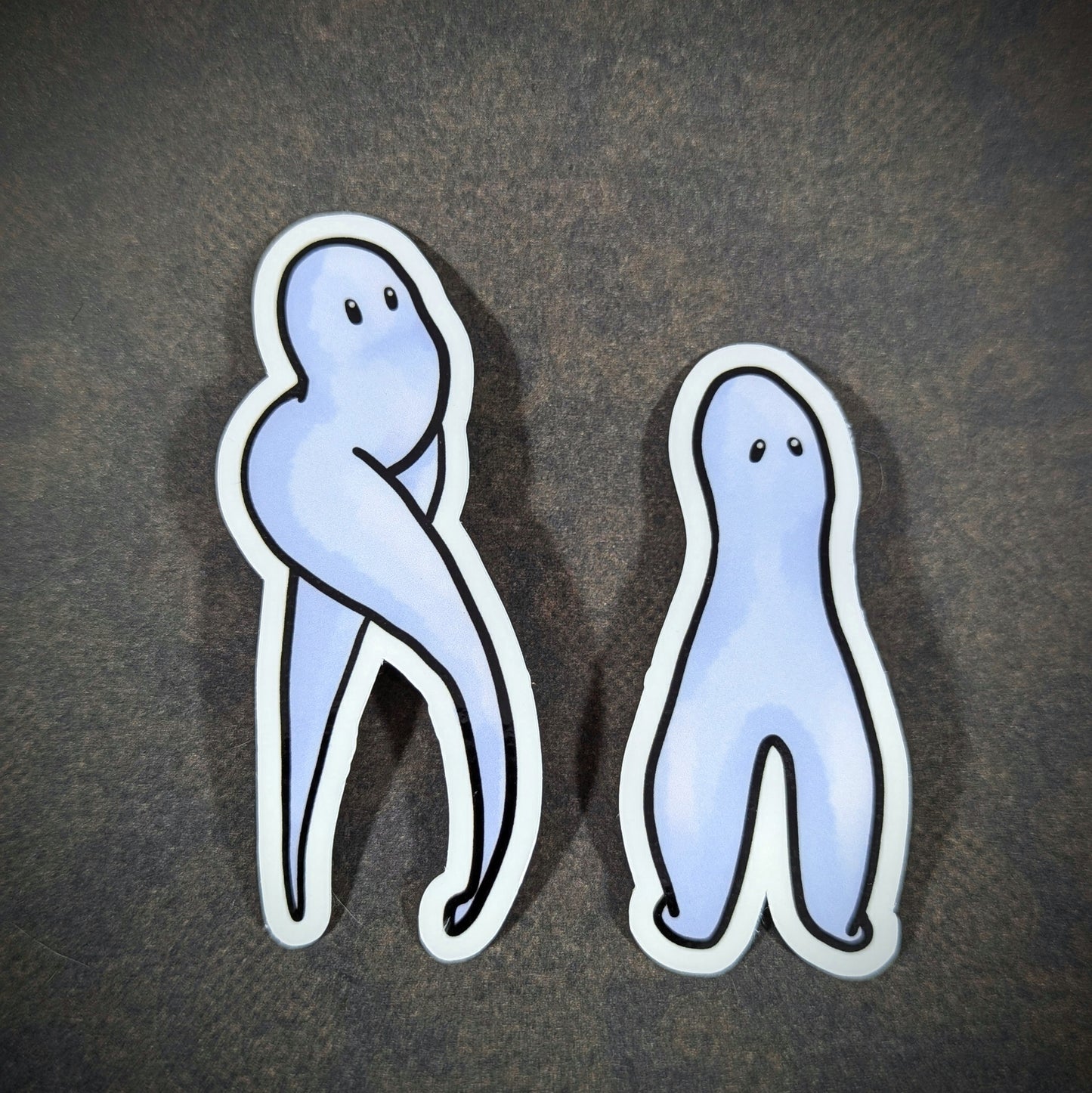 Sticker set featuring the Fresno Nightcrawlers, iconic cryptids known for their ghostly, minimalist appearance. Perfect for cryptid fans and collectors of unique, supernatural-themed decor.