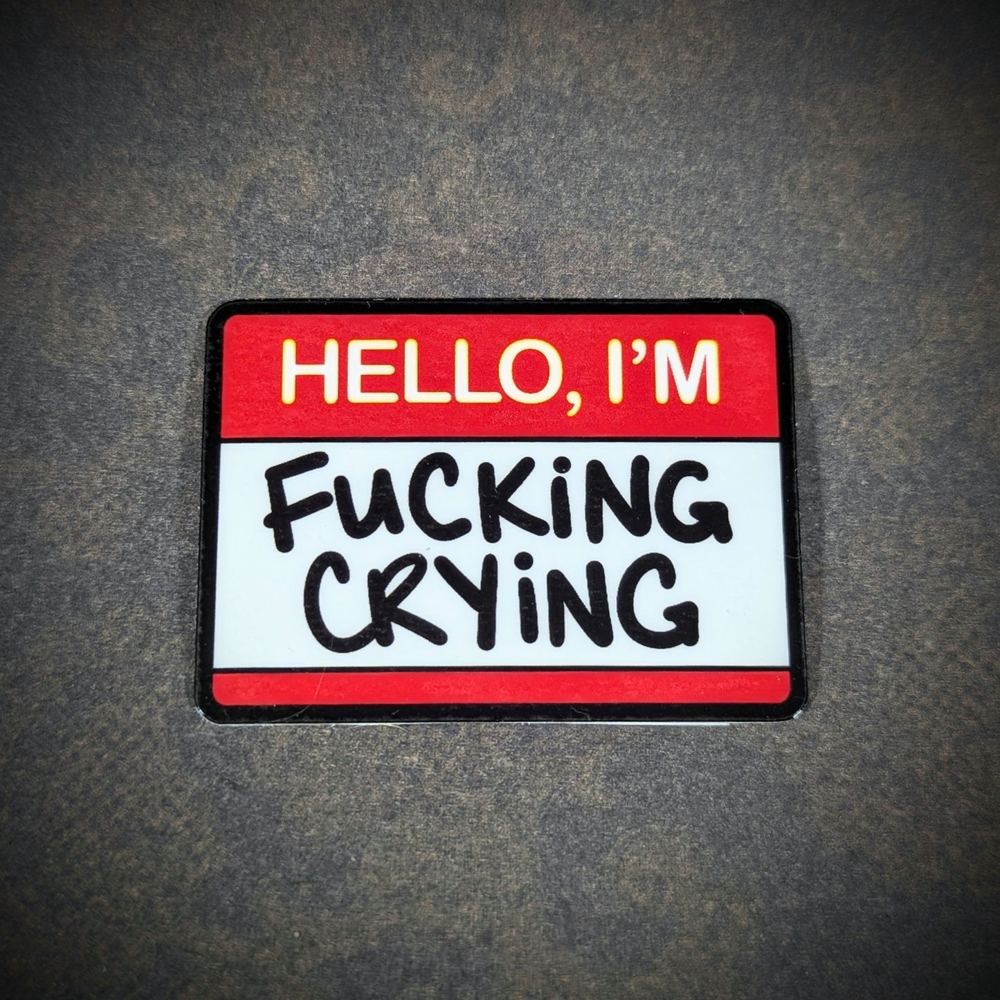 "Humorous 'Hello, I'm F***ing Crying' sticker with bold lettering, perfect for expressing relatable emotions with edgy humor. Ideal for laptops, water bottles, or anywhere you want to share a mood."