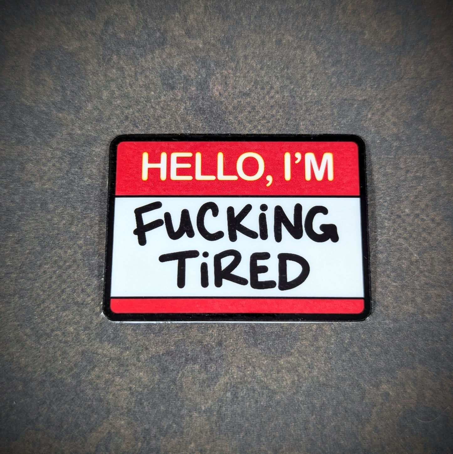 "Funny 'Hello, I'm F***ing Tired' sticker with bold text, perfect for expressing exhaustion with a touch of humor. Great for adding personality to laptops, water bottles, or personal items."