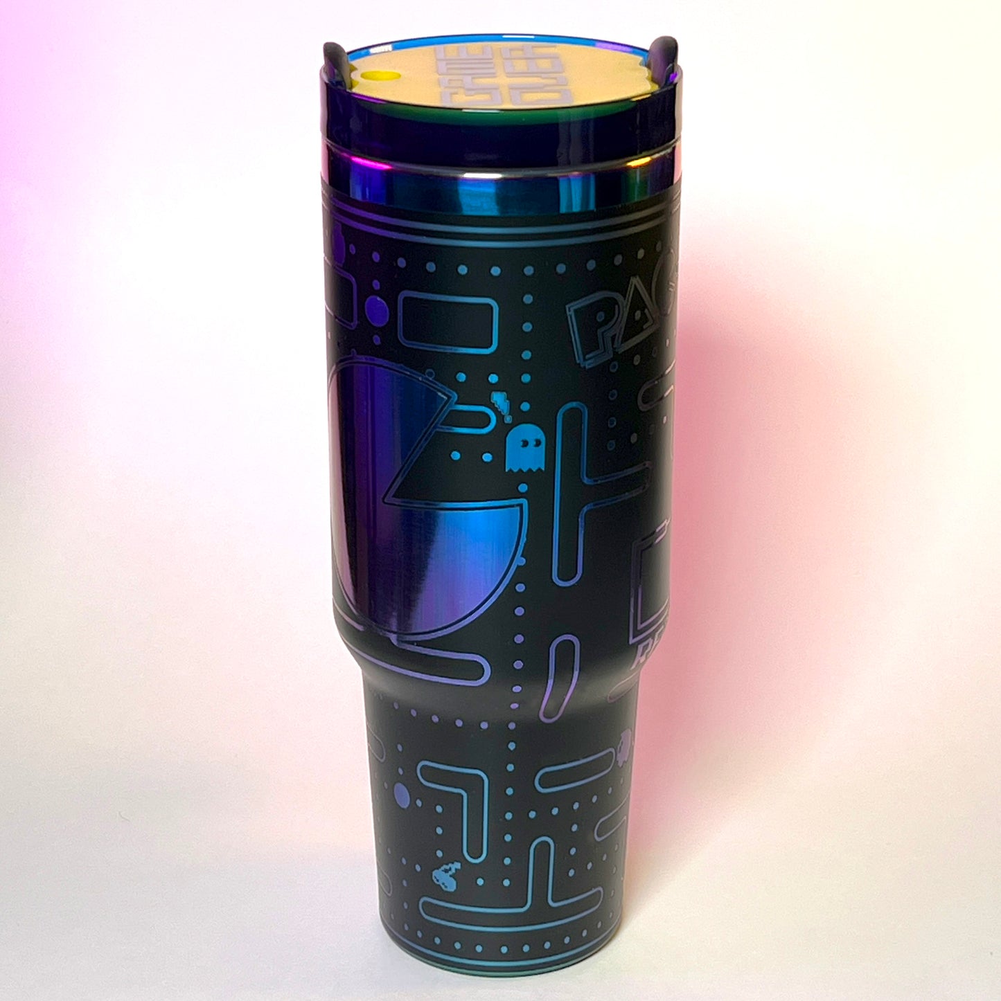 Laser engraved 40oz stainless steel tumbler featuring a retro Pac-Man design with iconic maze and ghosts, insulated to keep drinks hot or cold, perfect for gamers and retro arcade enthusiasts on the go.