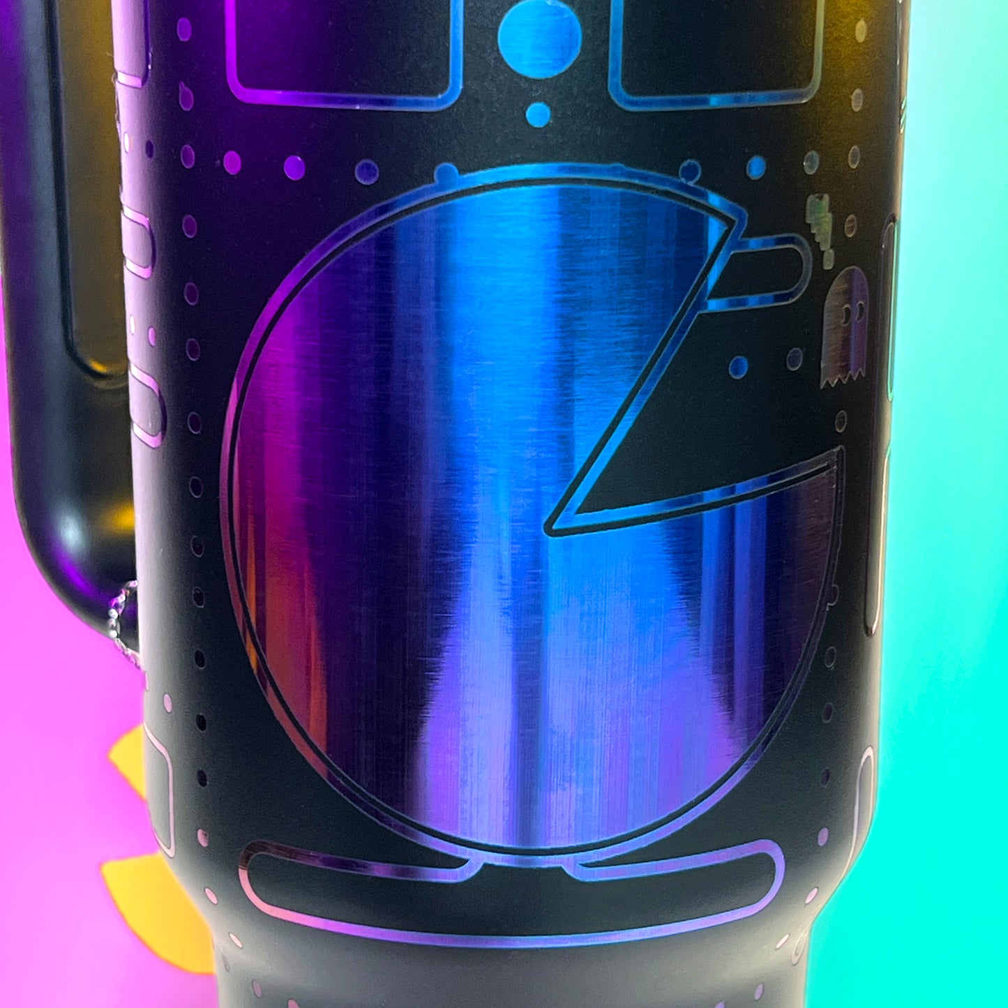 Laser engraved 40oz stainless steel tumbler featuring a retro Pac-Man design with iconic maze and ghosts, insulated to keep drinks hot or cold, perfect for gamers and retro arcade enthusiasts on the go.