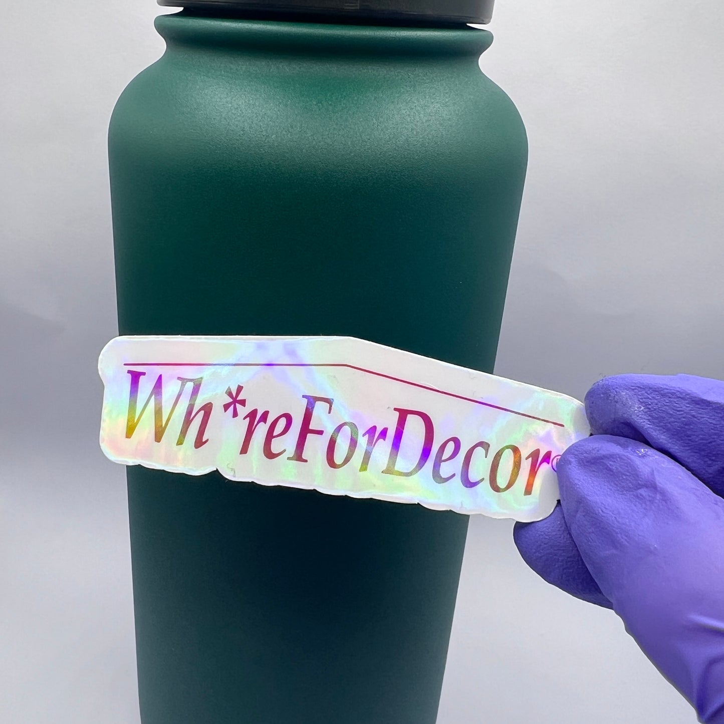 Holographic Wh*re for Decor vinyl sticker with a home goods-inspired design. Perfect for decor enthusiasts and anyone who loves a snarky touch.