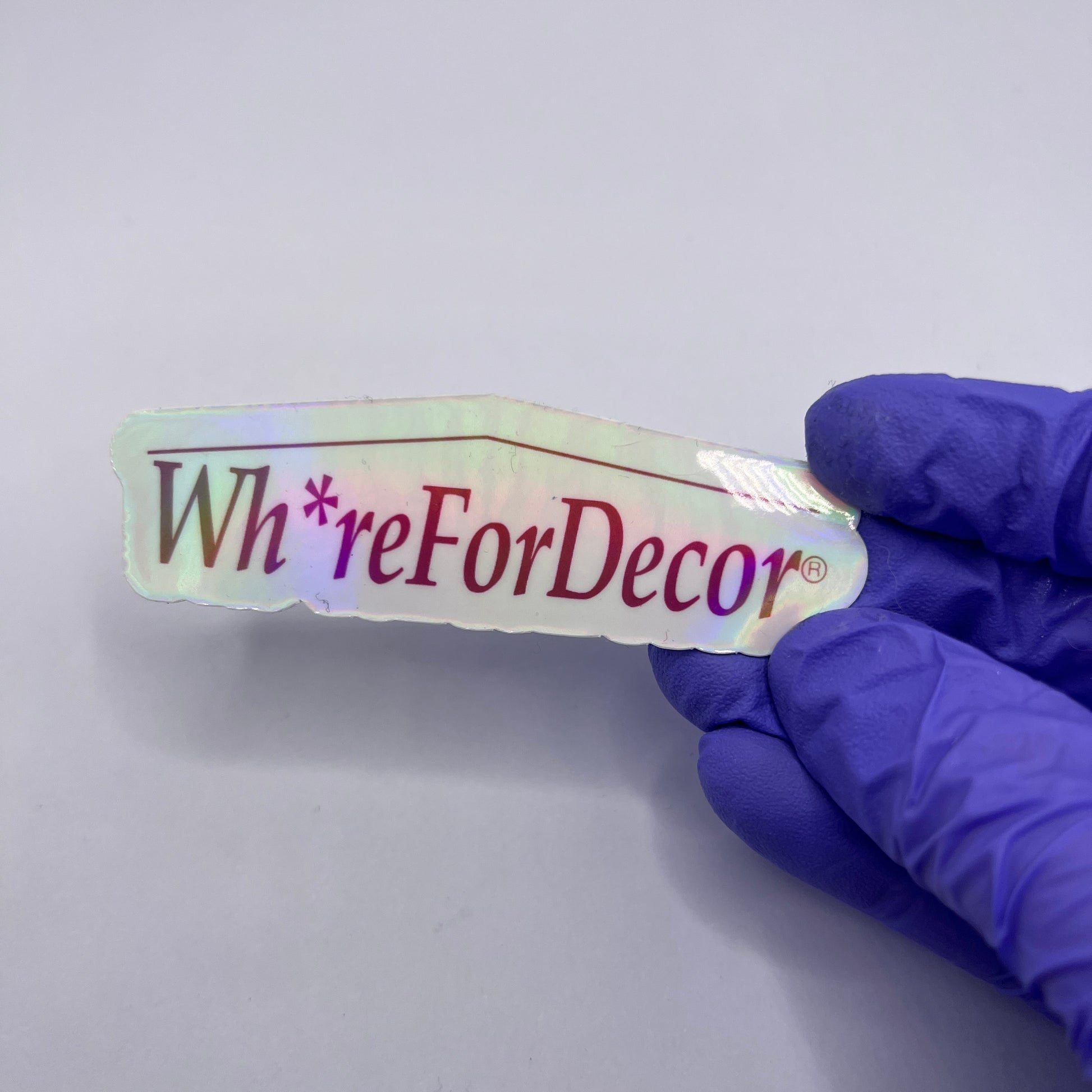 Holographic Wh*re for Decor vinyl sticker with a home goods-inspired design. Perfect for decor enthusiasts and anyone who loves a snarky touch.