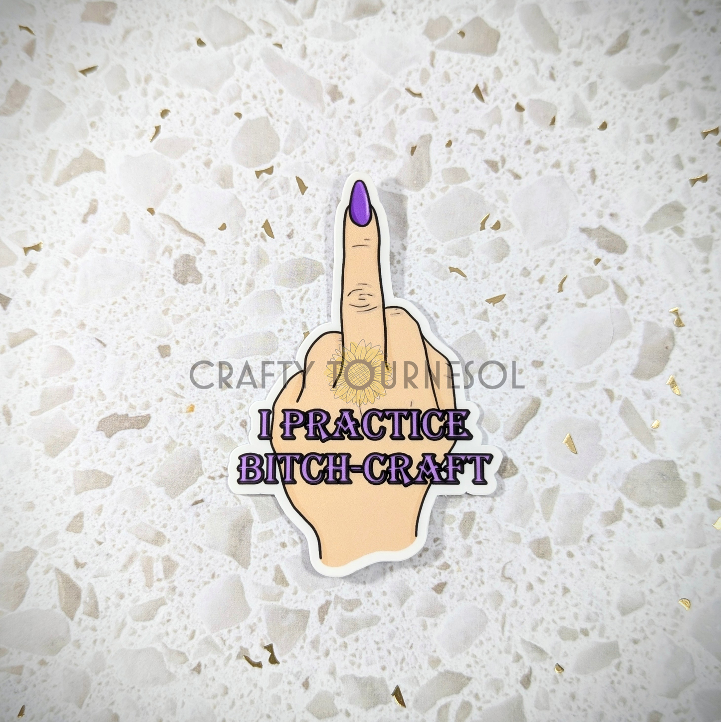 Alt text: "Sticker featuring a hand showing the middle finger with purple nail polish, captioned 'I Practice Bitch-Craft' in bold purple font. Fun, edgy design for witchcraft and empowerment themes."