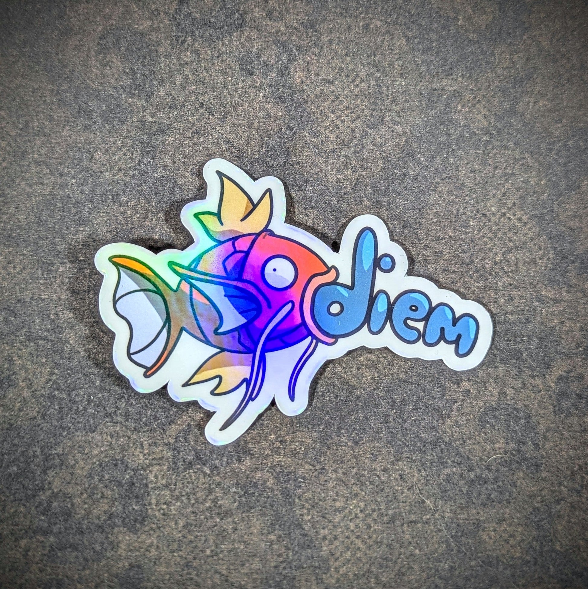 "Holographic 'Carpe Diem' inspired sticker featuring a vibrant Magikarp Pokemon design, perfect for water bottles, laptops, and notebooks. Adds a fun, motivational touch for gamers and fish enthusiasts alike."