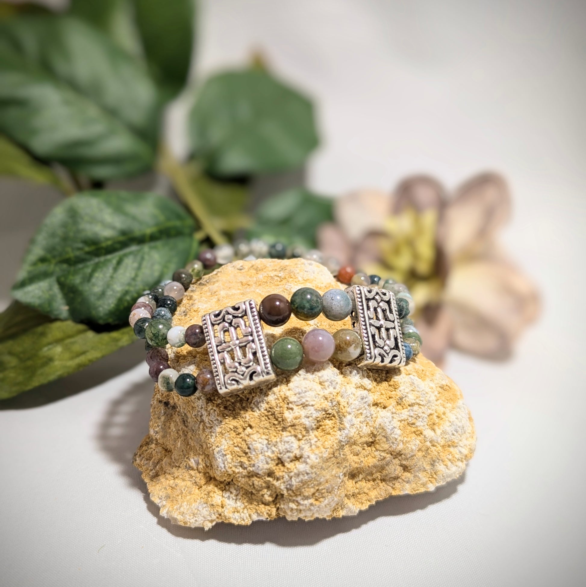 "Elegant agate bracelet with ornate silver accents, showcasing earthy green and pink gemstones. Perfect for nature-inspired jewelry lovers seeking a sophisticated accessory that adds charm to any outfit."