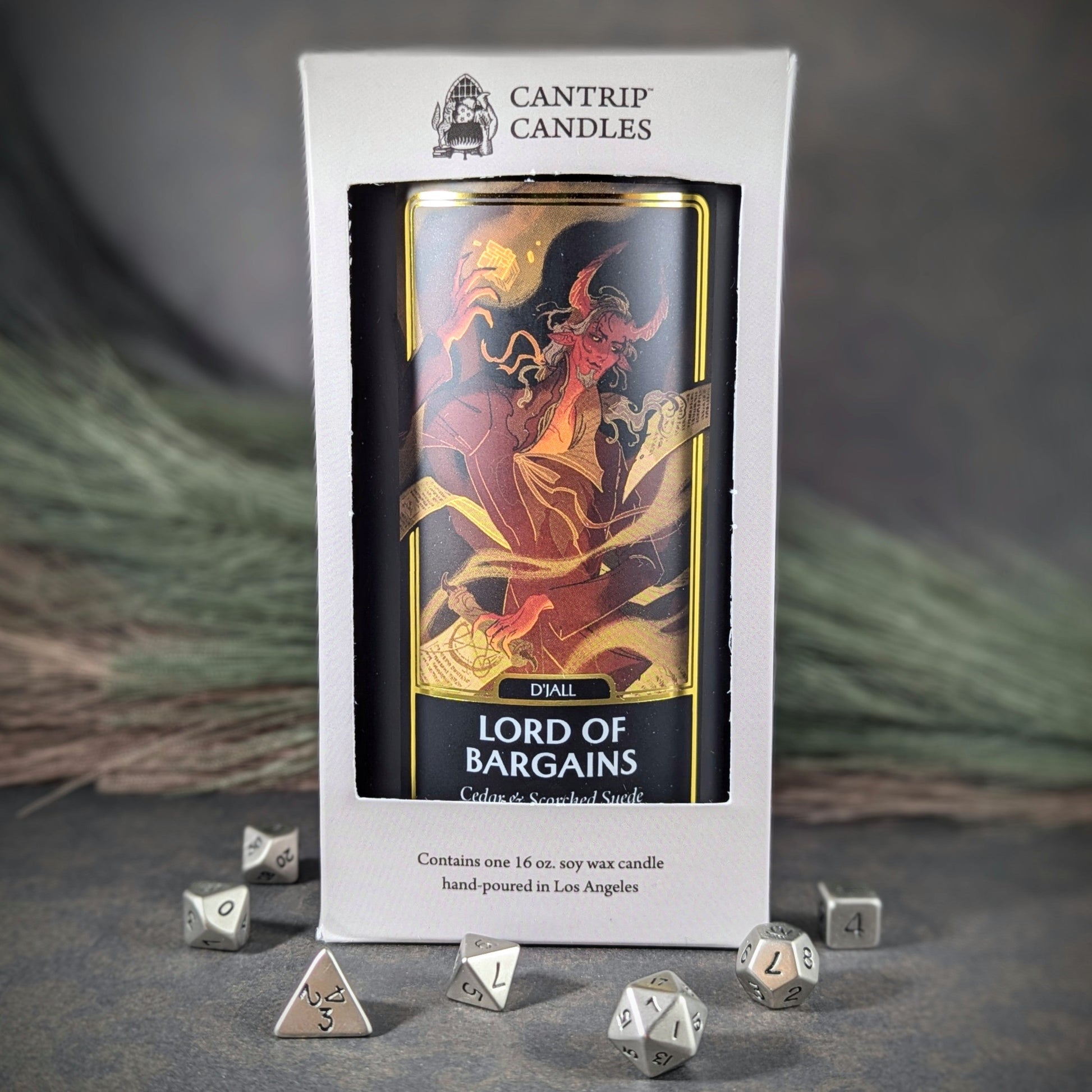 "D'Jall, Lord of Bargains 16 oz soy wax candle by Cantrip Candles featuring cedar and seaweed smoke scent, with dynamic artwork of a demon, staged with RPG dice, perfect for adding a dark, mystical atmosphere to any fantasy-themed space."