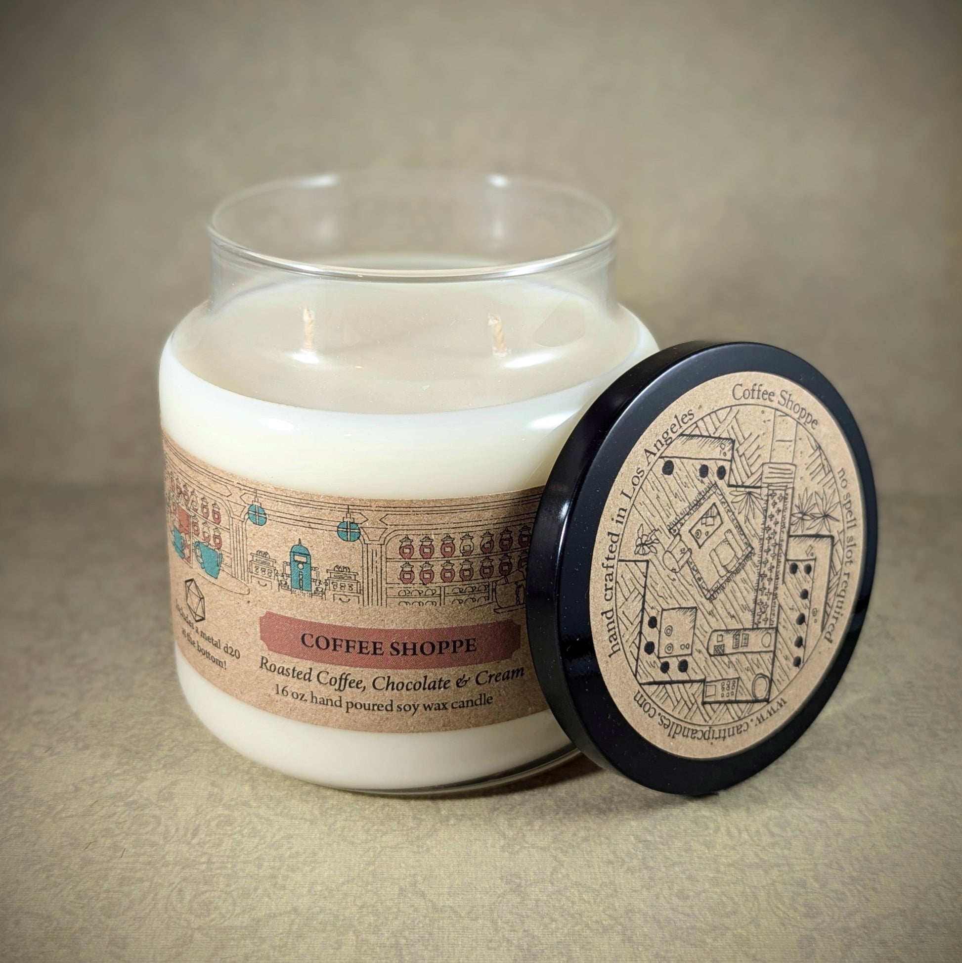 "Coffee Shoppe candle by Cantrip Candles, 16 oz soy wax with rich scents of roasted coffee, chocolate, and cream. Vintage-inspired RPG map lid, perfect for cozy ambiance or themed tabletop gaming sessions."