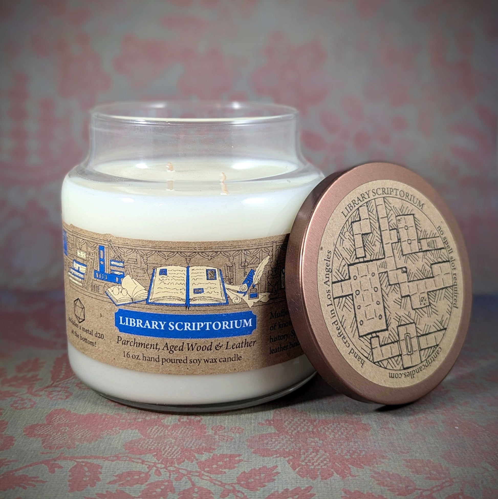 "Library Scriptorium candle by Cantrip Candles, 16 oz soy wax with scents of parchment, aged wood, and leather. Perfect for book lovers, featuring detailed library-inspired artwork on the lid."