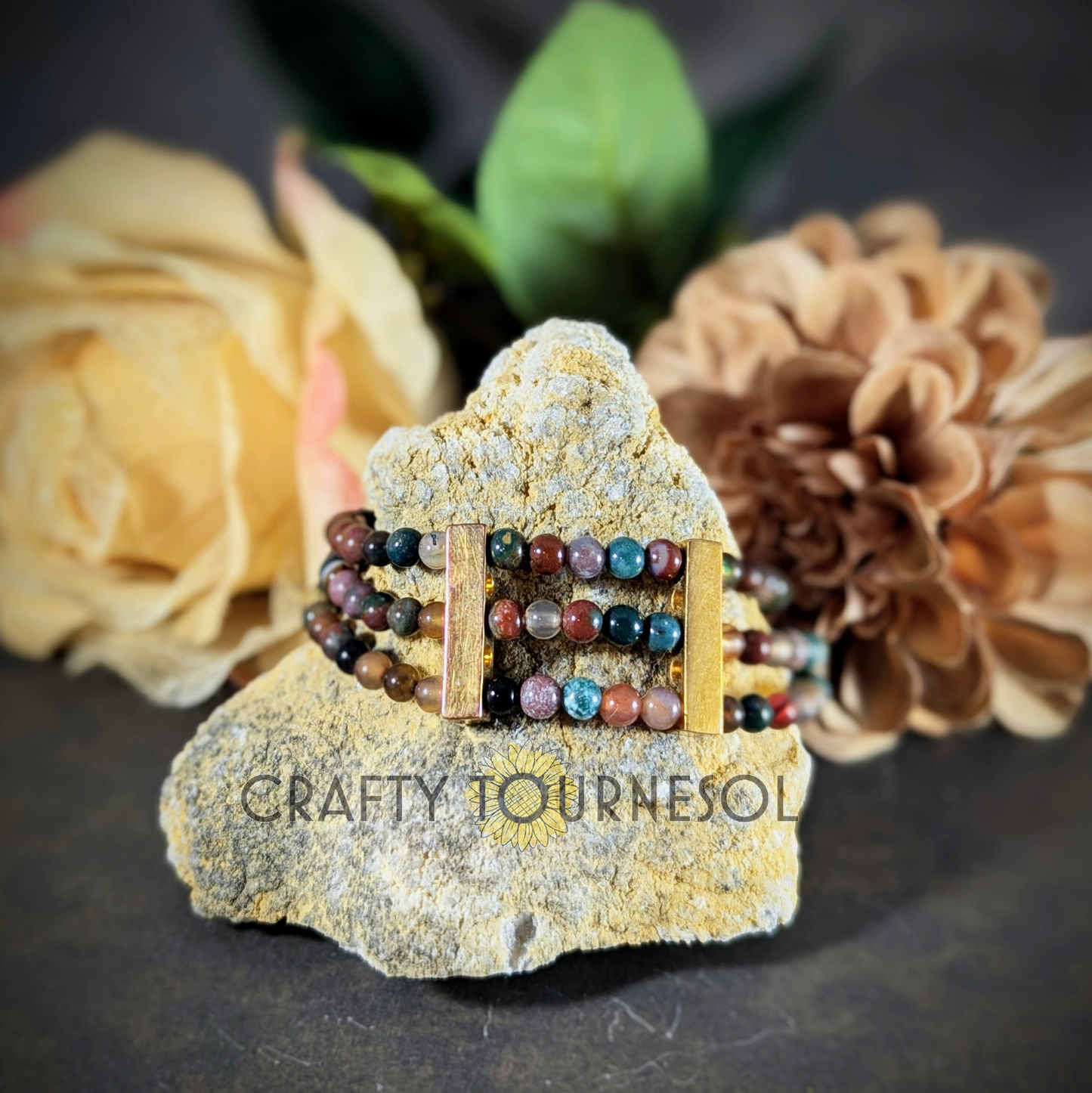 "Elegant handcrafted multi-strand bracelet with earthy agate gemstones and gold accents by Crafty Tournesol, perfect for bohemian and natural styles. Adds a touch of sophistication and color to any outfit."