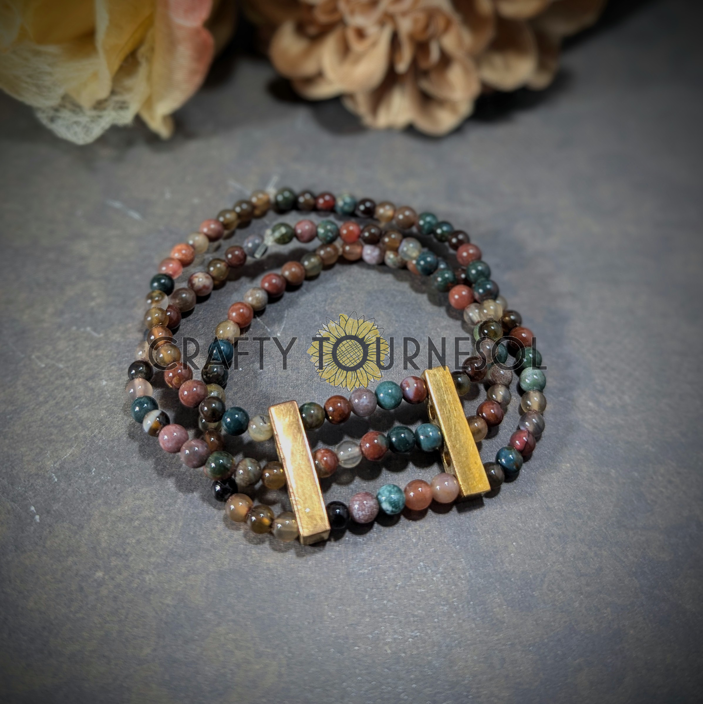 "Elegant handcrafted multi-strand bracelet with earthy agate gemstones and gold accents by Crafty Tournesol, perfect for bohemian and natural styles. Adds a touch of sophistication and color to any outfit."