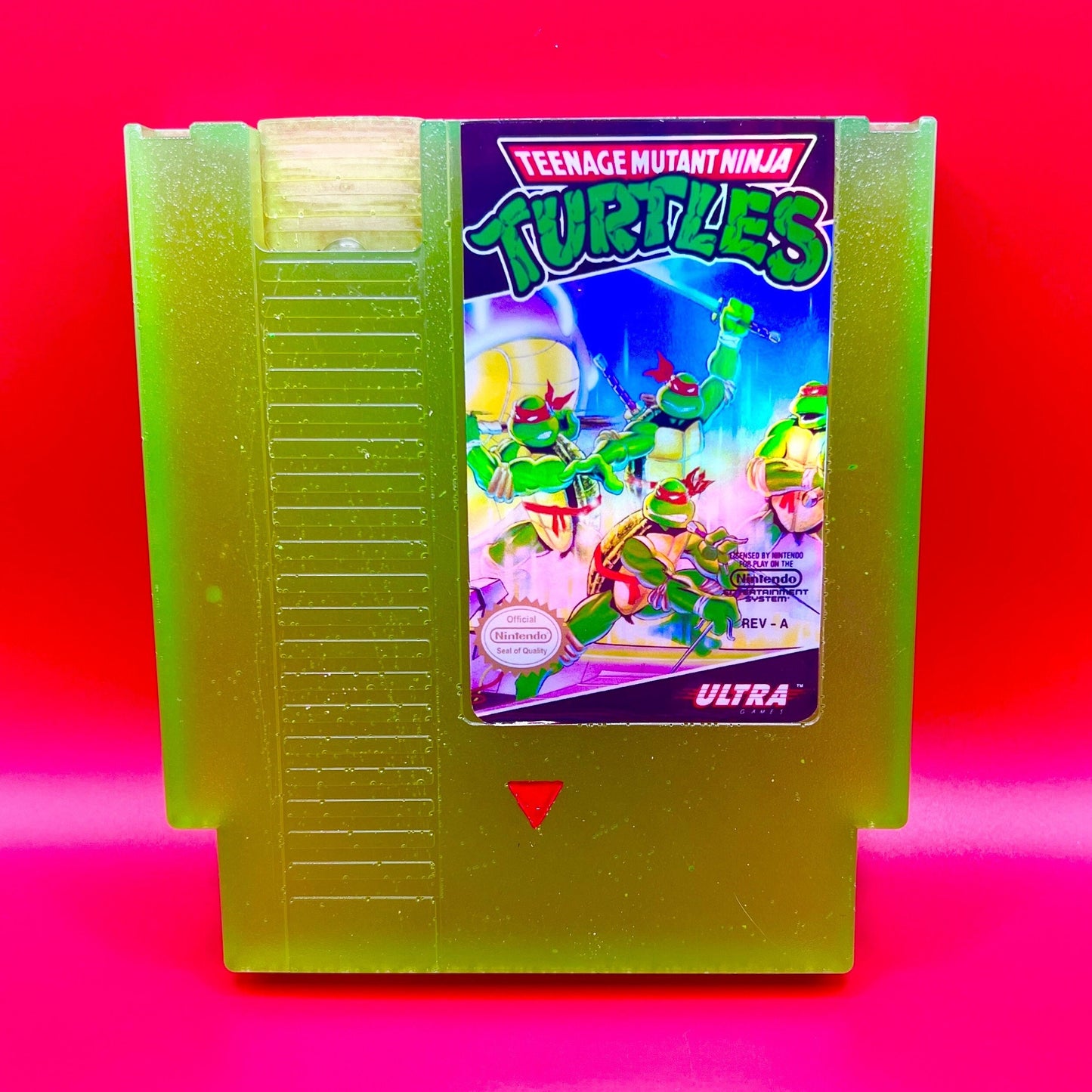 This glowing Teenage Mutant Ninja Turtles NES cartridge is a retro, geeky collectible display. Handmade with glowing elements, it's perfect for nostalgic gamers and TMNT fans as a unique gift or decor.