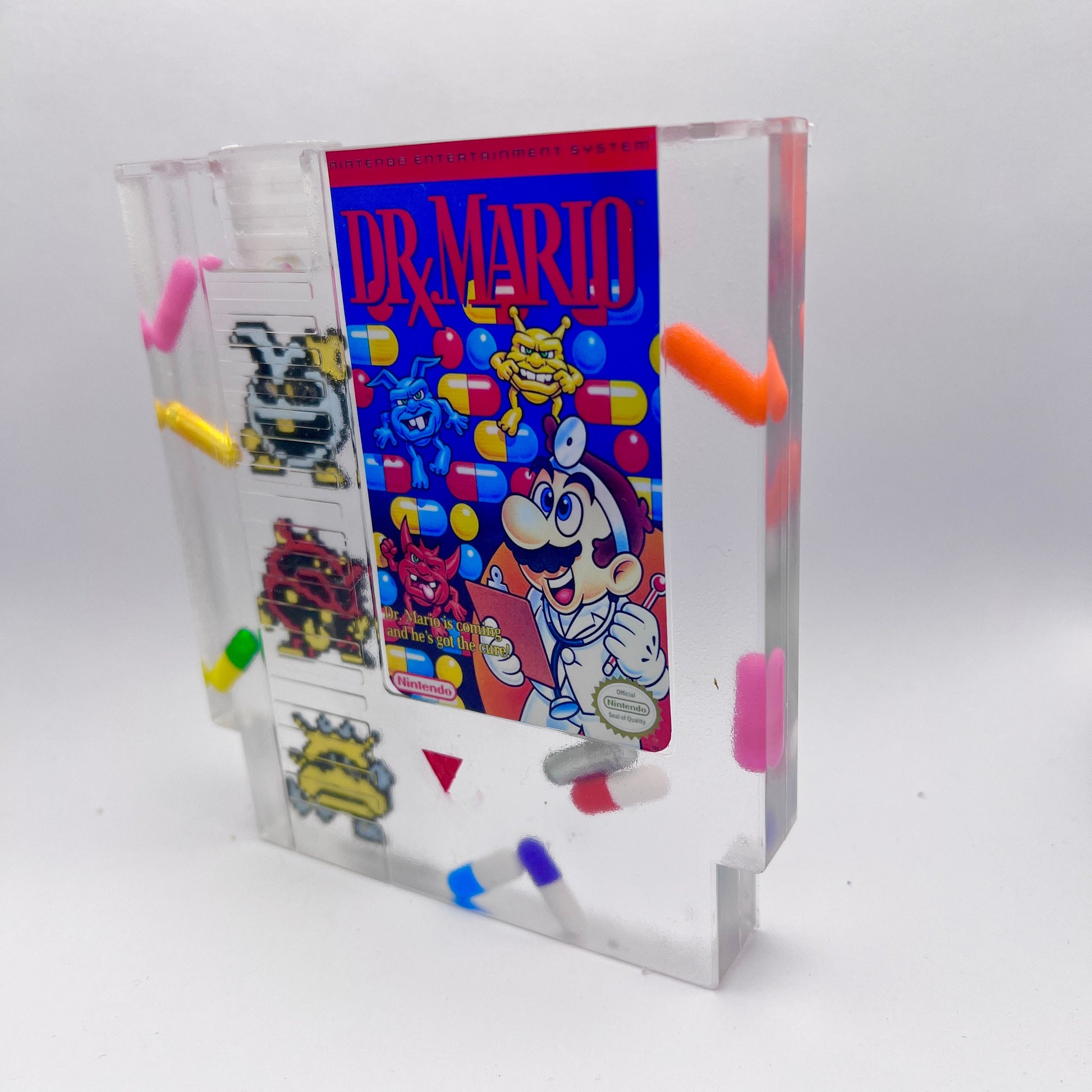 Custom handmade Dr. Mario NES cartridge featuring iconic pixelated viruses and colorful pills. A perfect gift for retro gaming enthusiasts or unique home decor for lovers of nostalgic Nintendo games.