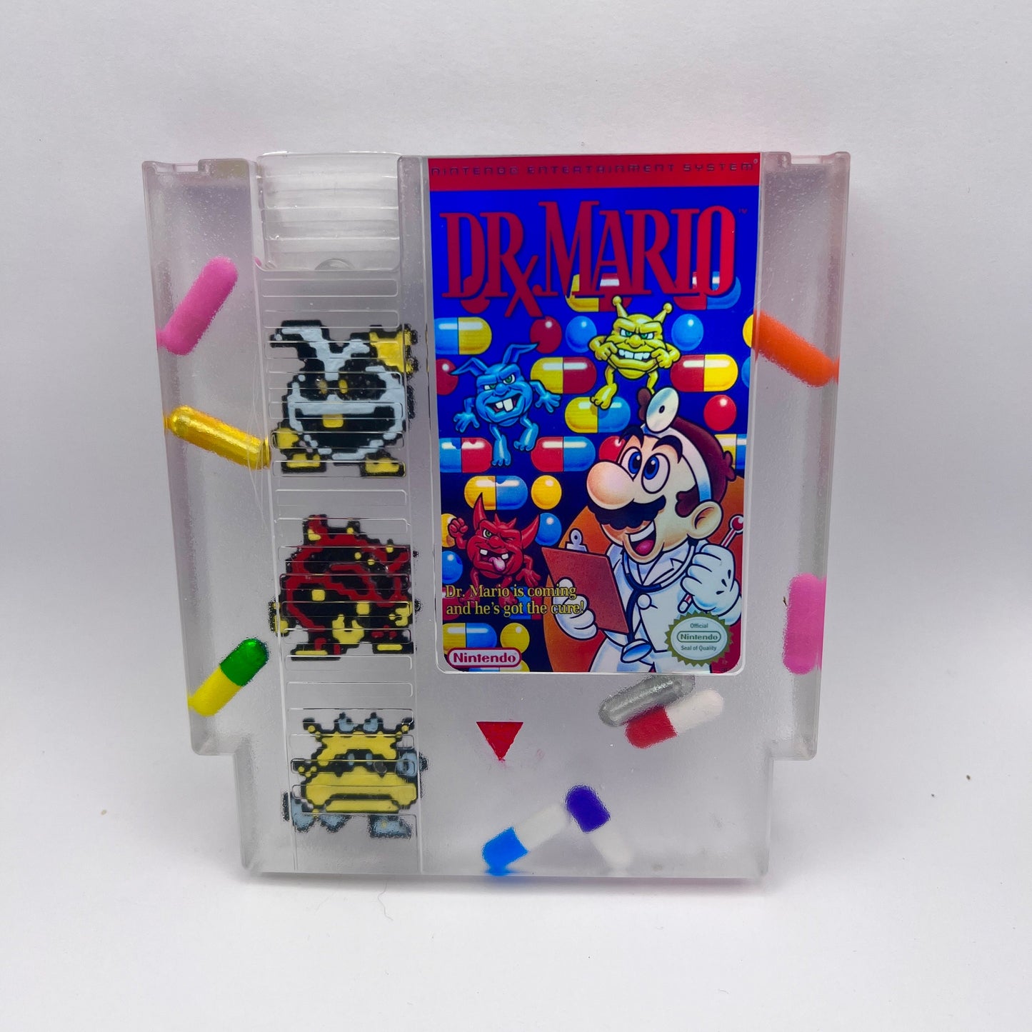 Custom handmade Dr. Mario NES cartridge featuring iconic pixelated viruses and colorful pills. A perfect gift for retro gaming enthusiasts or unique home decor for lovers of nostalgic Nintendo games.