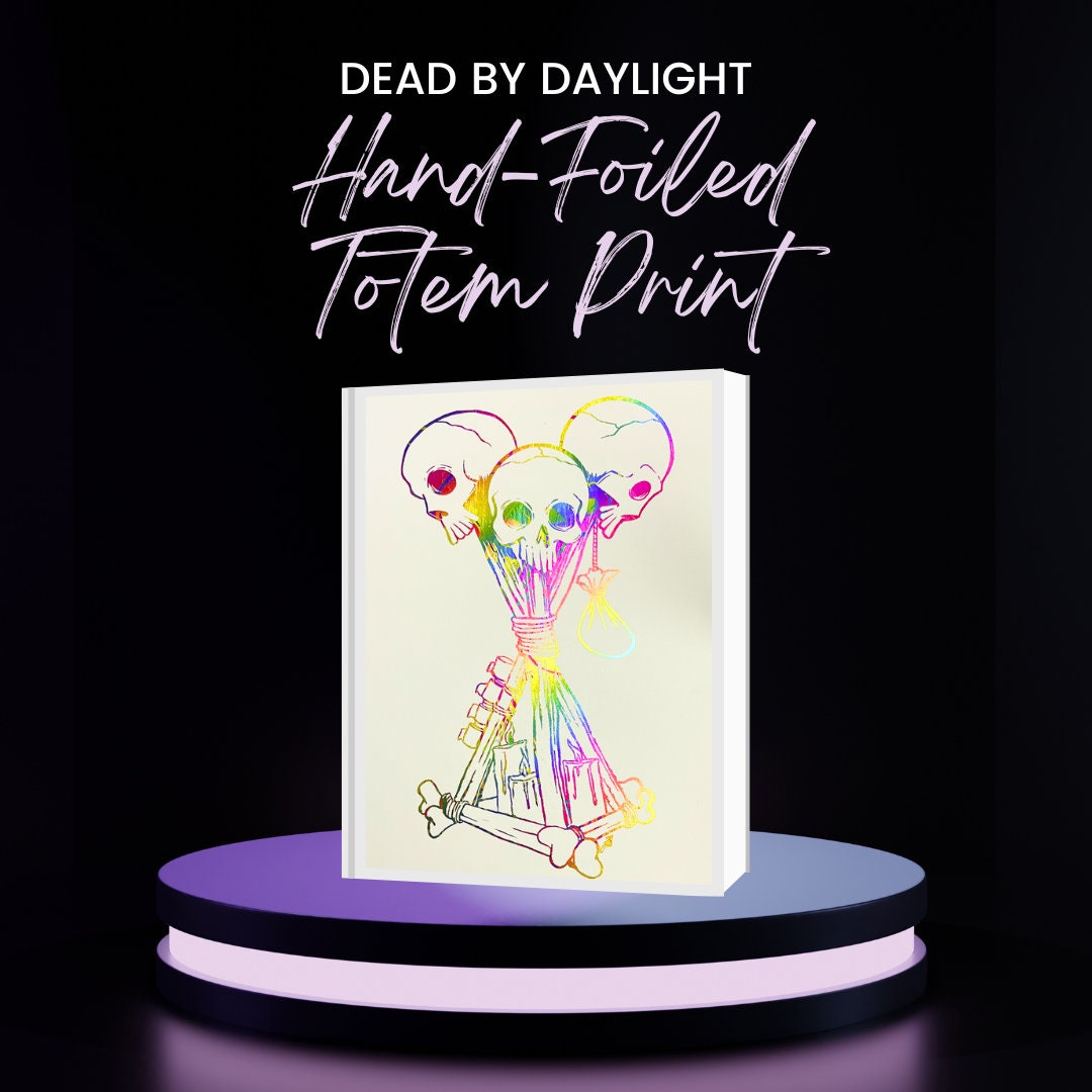 Hand-foiled Dead by Daylight totem artwork featuring three rainbow-colored skulls tied with candles and bones on black cardstock. This custom, vibrant totem design brings a unique twist to iconic game imagery, perfect for horror and gaming fans.