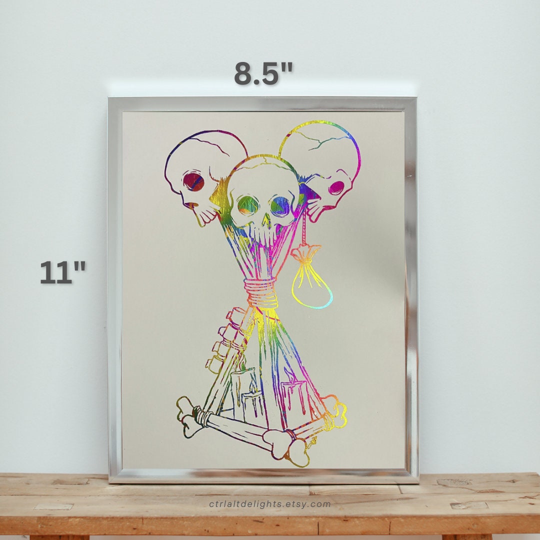 Hand-foiled Dead by Daylight totem artwork featuring three rainbow-colored skulls tied with candles and bones on black cardstock. This custom, vibrant totem design brings a unique twist to iconic game imagery, perfect for horror and gaming fans.