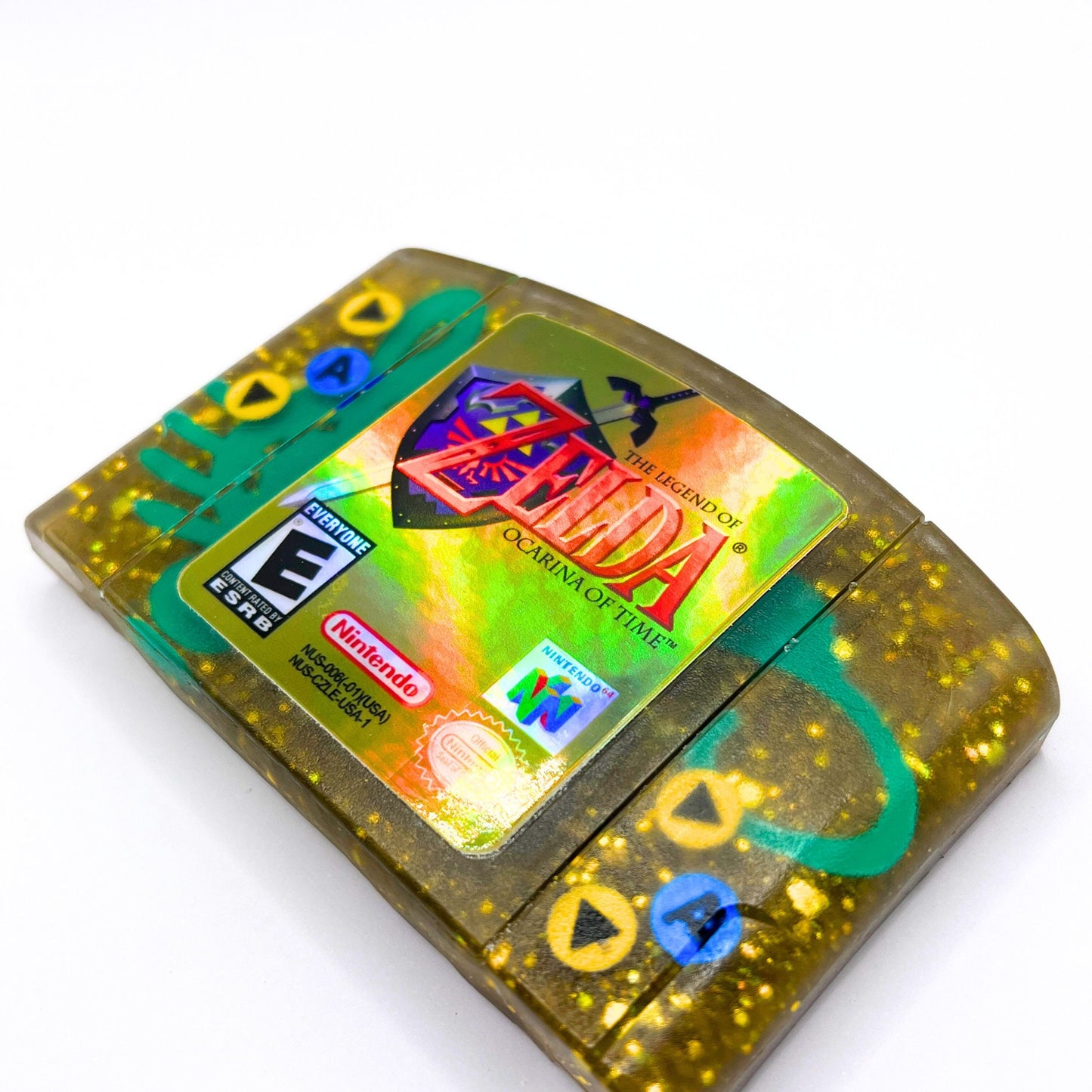 This handmade Zelda Ocarina of Time resin cartridge features vibrant custom art, adding a nostalgic touch for retro gaming fans. Ideal as a unique gift or display piece for collectors and gamers alike. 