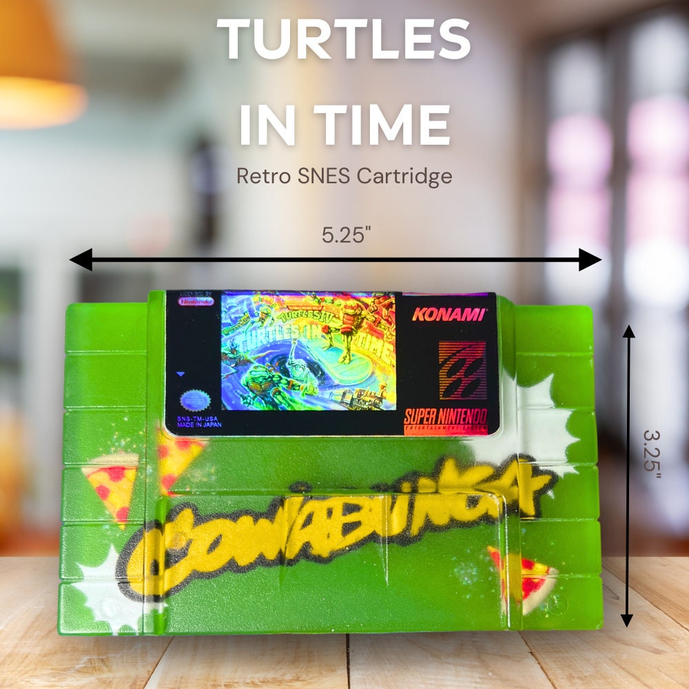 Handmade resin replica of the classic SNES game Turtles in Time. Vibrant green design with graffiti-style elements and retro cartridge art. Perfect for gamers, collectors, or as a unique shelf display for TMNT fans