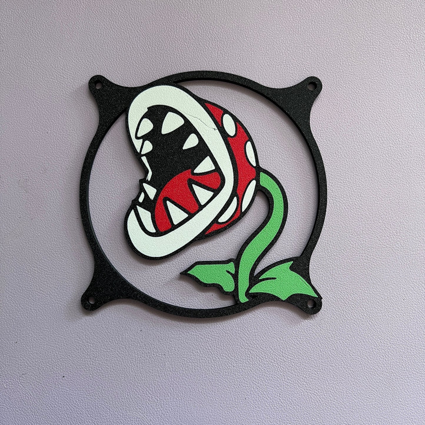 A set of two Nintendo-inspired PC fan grills featuring Piranha Plant and Bowser designs. These stylish grills enhance cooling while adding a fun touch to gaming setups. Ideal for custom PC builds.