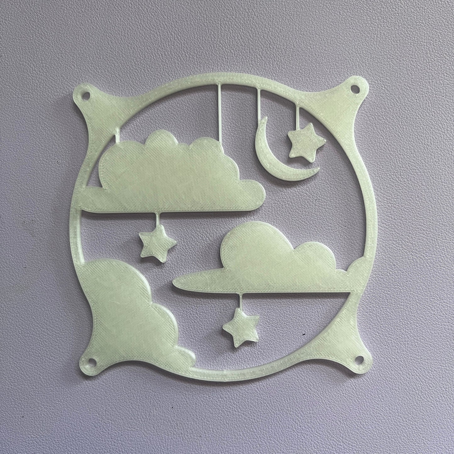 This whimsical 3D printed PC fan grille cover features pastel clouds, stars, and a crescent moon, adding a playful and cute touch to your gaming setup or workspace with a soft, kawaii style.