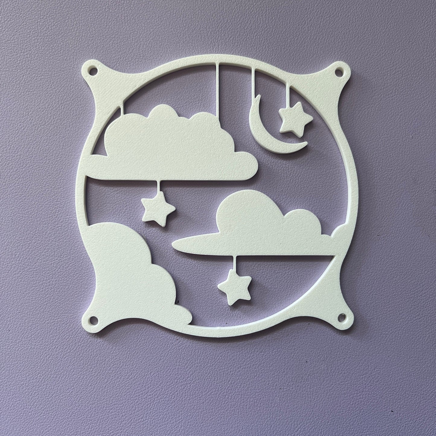 This whimsical 3D printed PC fan grille cover features pastel clouds, stars, and a crescent moon, adding a playful and cute touch to your gaming setup or workspace with a soft, kawaii style.