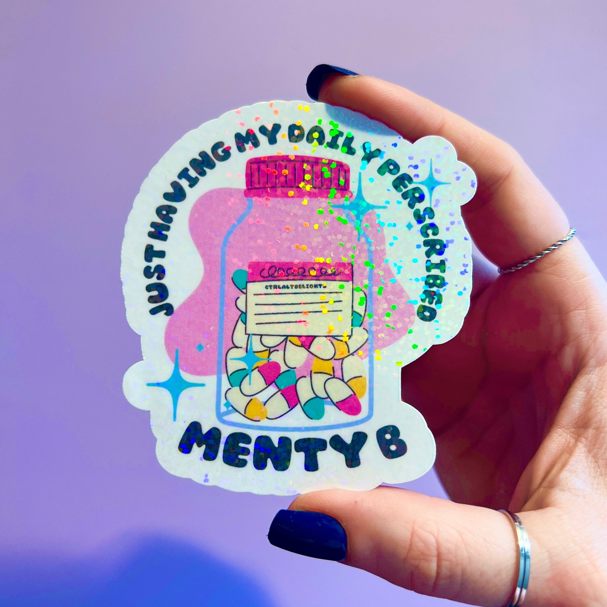 Holographic sticker featuring a prescription bottle with the words 'Just Having My Daily Prescription of Menty B.' Perfect for mental health humor and adding some fun to your laptop, water bottle, or journal.