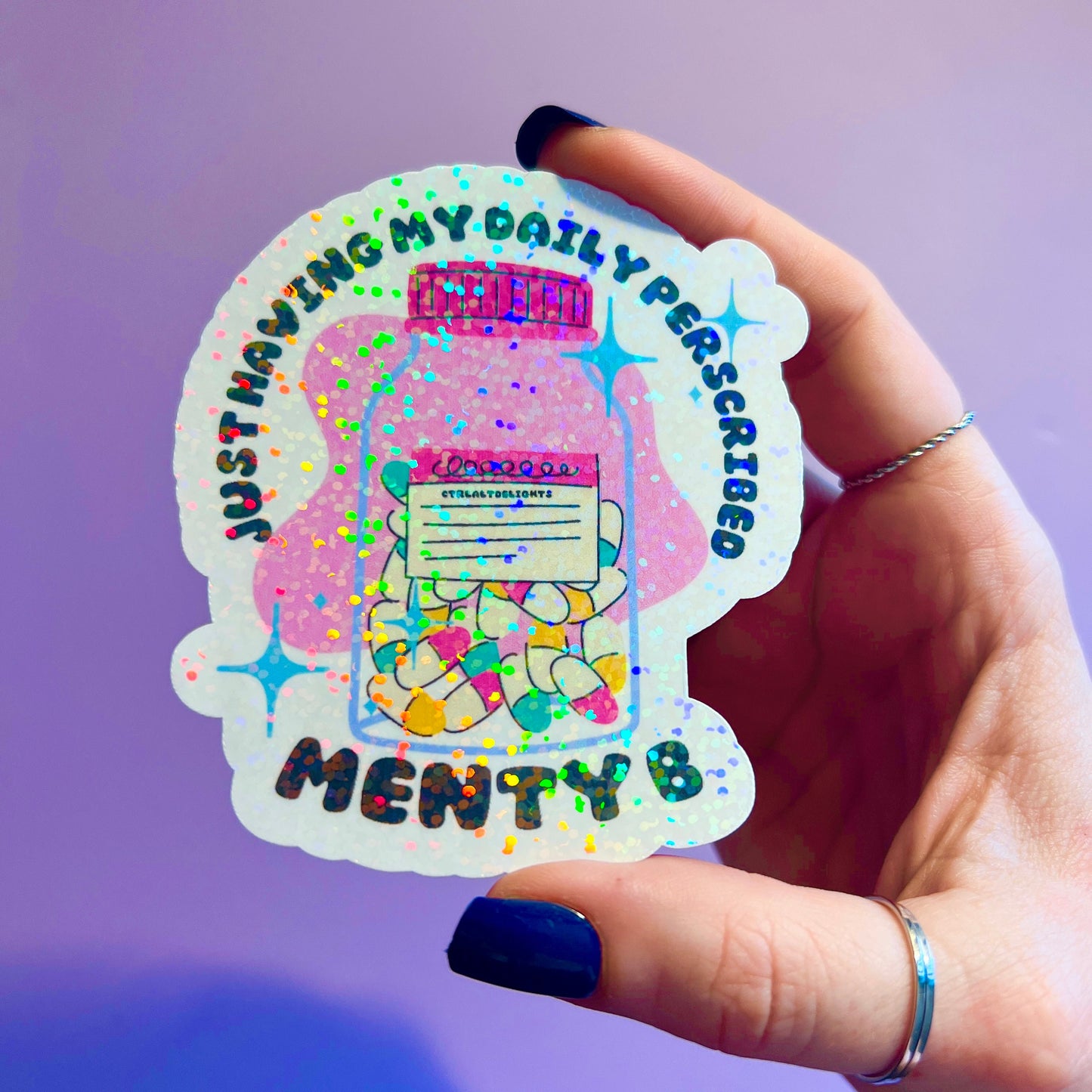 Holographic sticker featuring a prescription bottle with the words 'Just Having My Daily Prescription of Menty B.' Perfect for mental health humor and adding some fun to your laptop, water bottle, or journal.