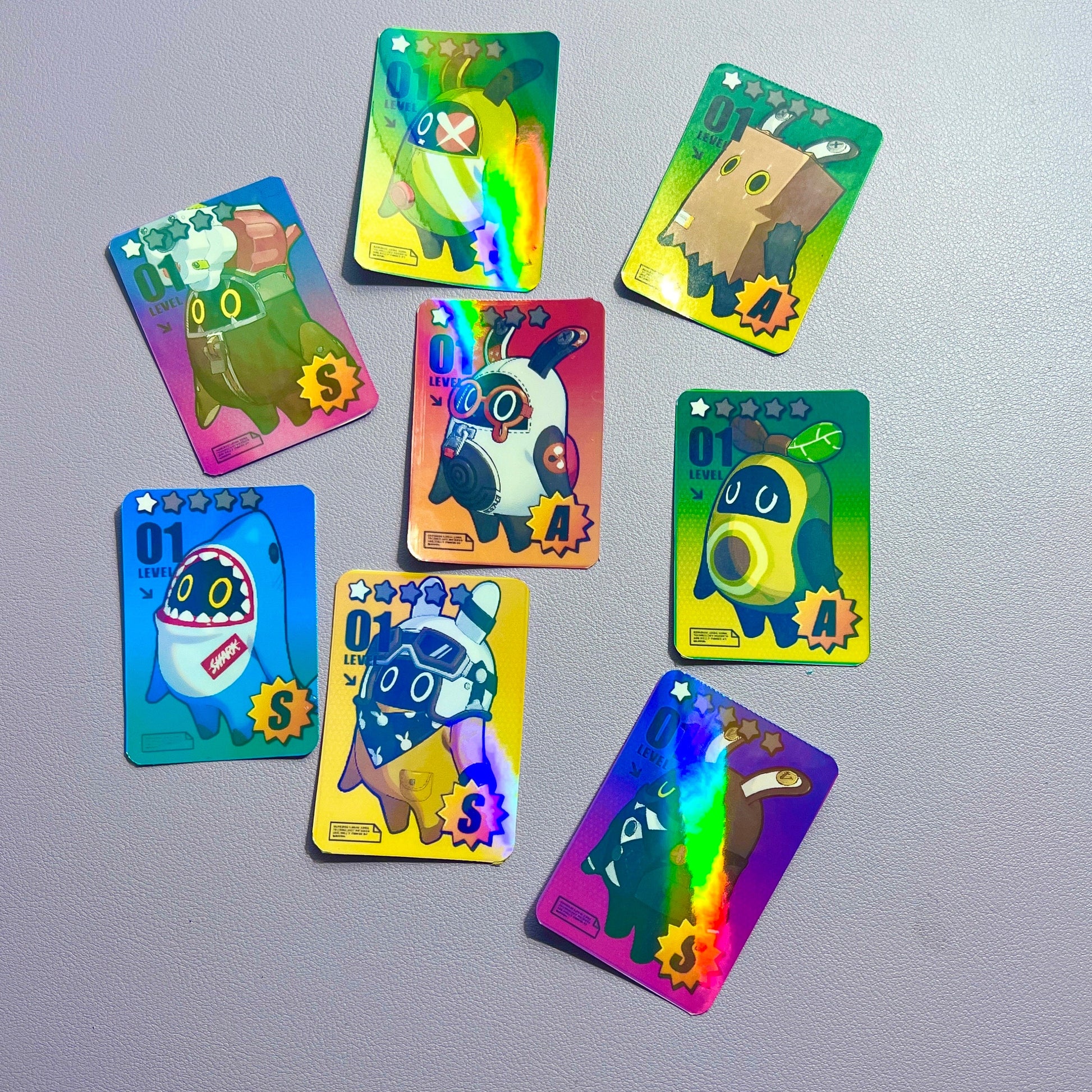 These Zenless Zone Zero Bangboo stickerd features adorable characters from the popular game. Made with holographic material, these stickers are perfect for fans of gaming and anime. Collect them all!