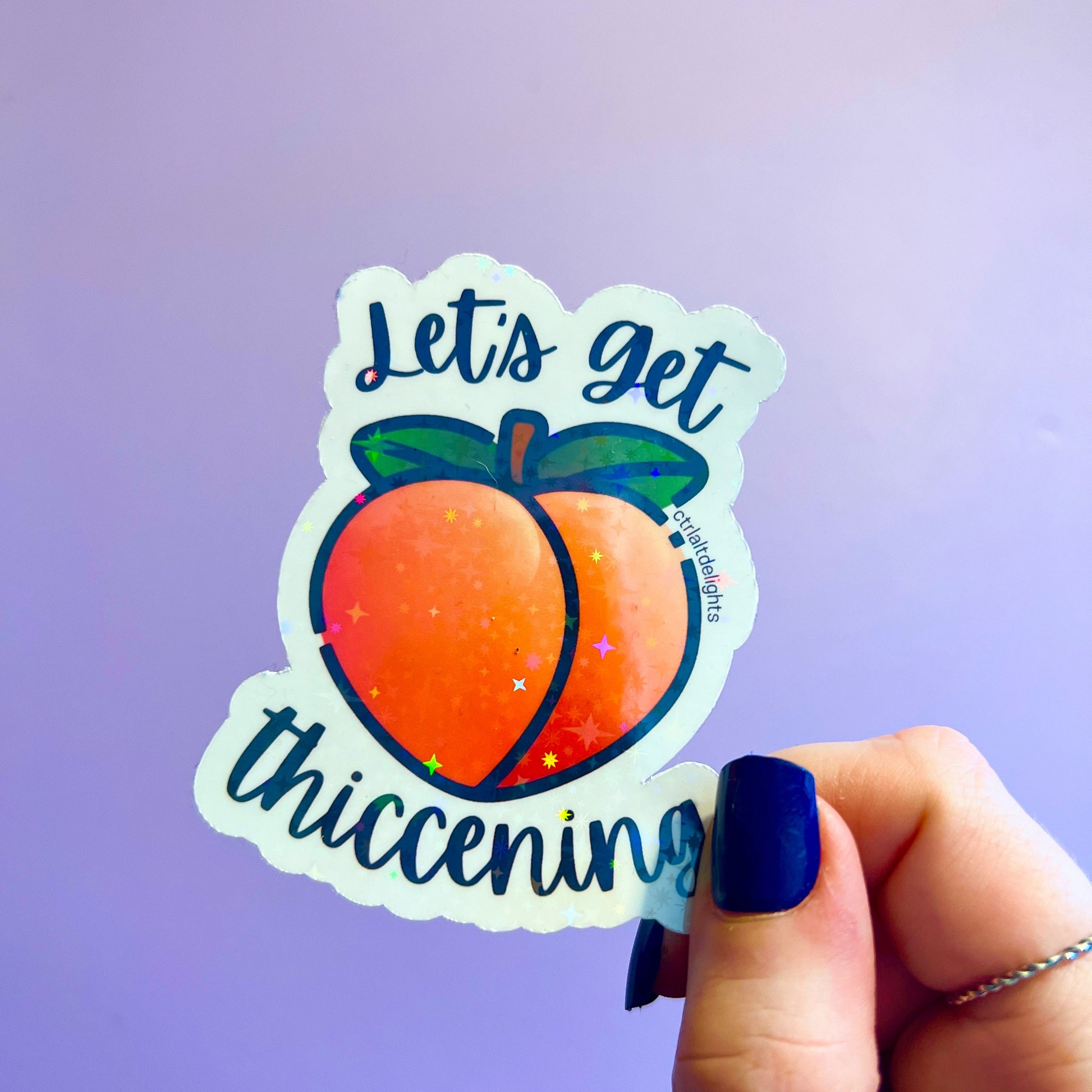 Holographic "Let's Get Thiccening" peach sticker featuring a cute peach design. Perfect for decorating water bottles, laptops, journals, or any surface that needs a fun, thicc touch.