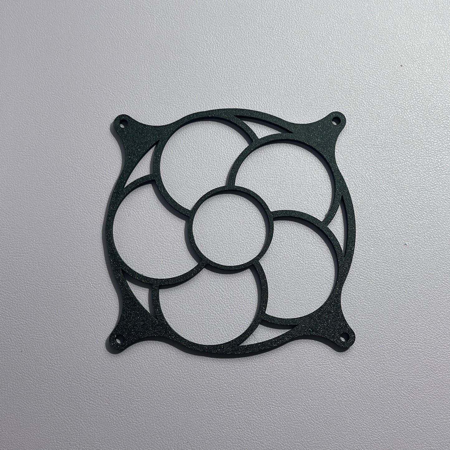 This minimalist flower-shaped custom PC fan grill enhances both the cooling efficiency and aesthetic of your gaming setup. Compatible with most standard PC fans, its a unique, functional piece for gamers.