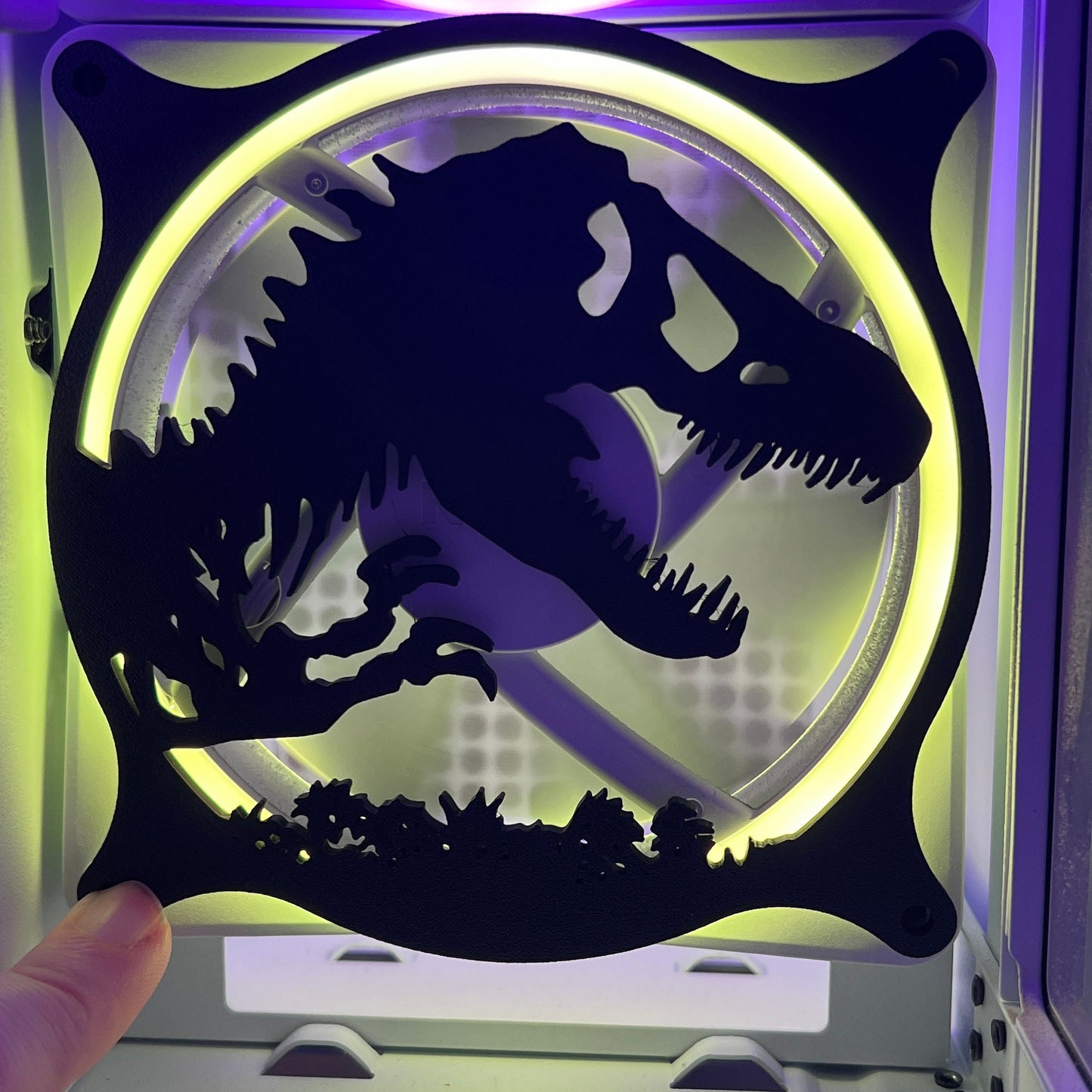 This 3D printed T-Rex dinosaur fan grill cover is perfect for adding a prehistoric touch to your gaming setup. Designed to fit PC fan grills, it adds protection and style. Ideal for dinosaur and gaming enthusiasts alike.