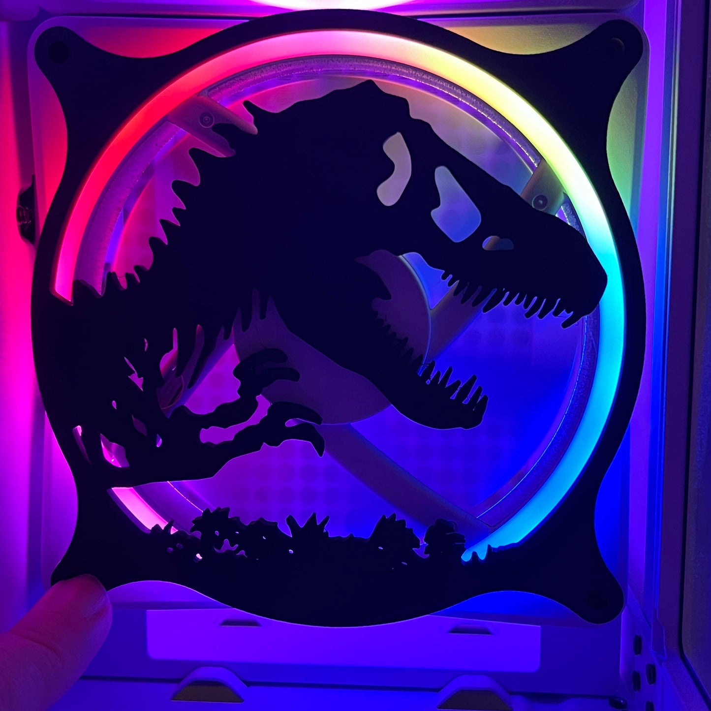 This 3D printed T-Rex dinosaur fan grill cover is perfect for adding a prehistoric touch to your gaming setup. Designed to fit PC fan grills, it adds protection and style. Ideal for dinosaur and gaming enthusiasts alike.