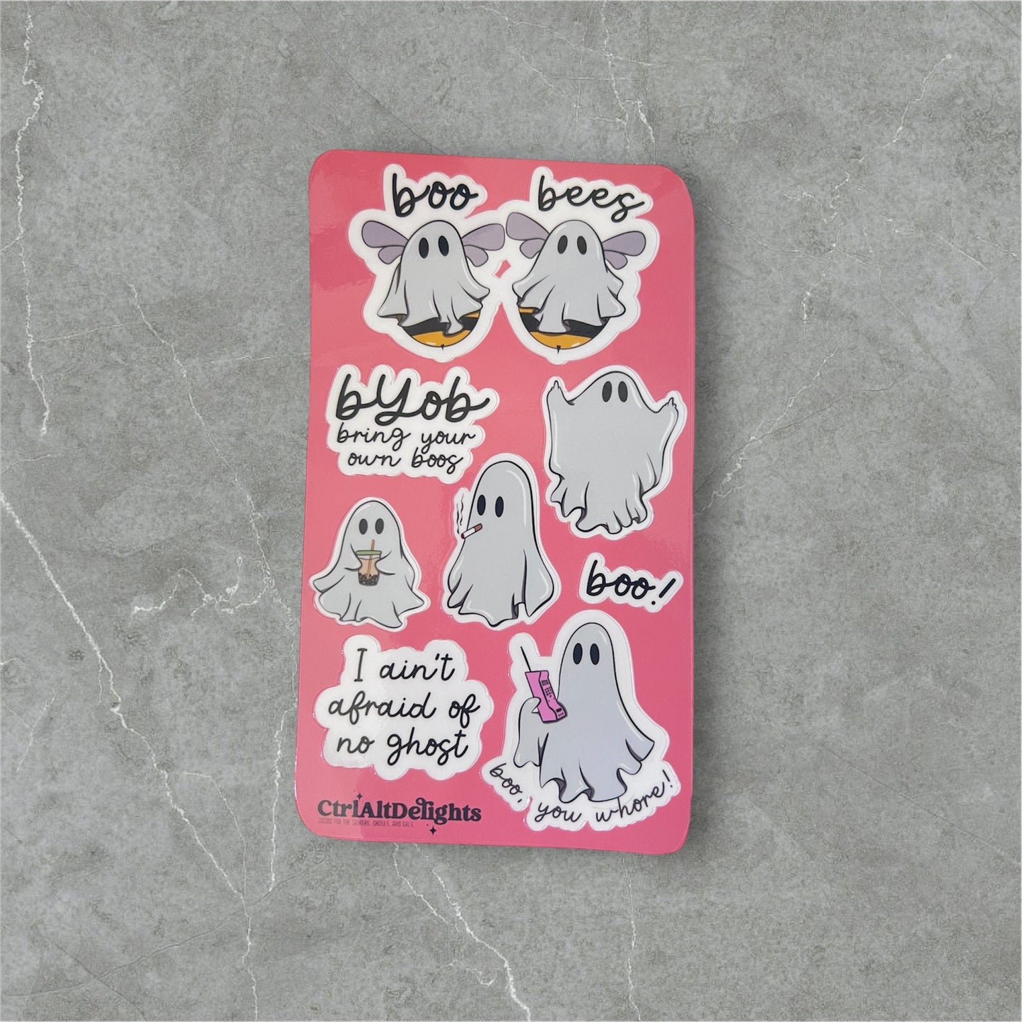 Fun ghost-themed sticker sheet featuring cute and playful ghost illustrations with humorous sayings like ‘Boo Bees’ and ‘I Ain’t Afraid of No Ghost.’ Perfect for Halloween or spooky fun decorating. Holographic finish.