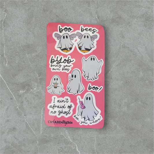 Fun ghost-themed sticker sheet featuring cute and playful ghost illustrations with humorous sayings like ‘Boo Bees’ and ‘I Ain’t Afraid of No Ghost.’ Perfect for Halloween or spooky fun decorating. Holographic finish.