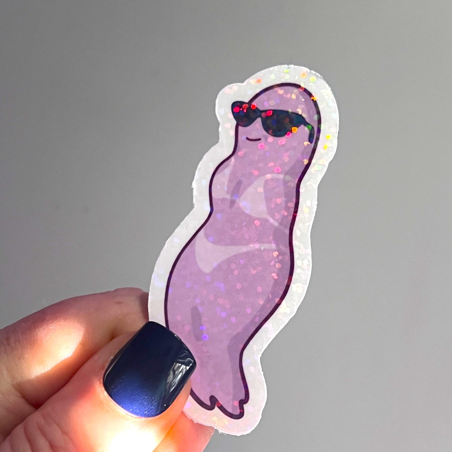 Holographic ghost sticker set featuring three adorable and sassy ghost designs. Perfect for decorating laptops, water bottles, or journals. Add a spooky yet cute touch to your accessories.