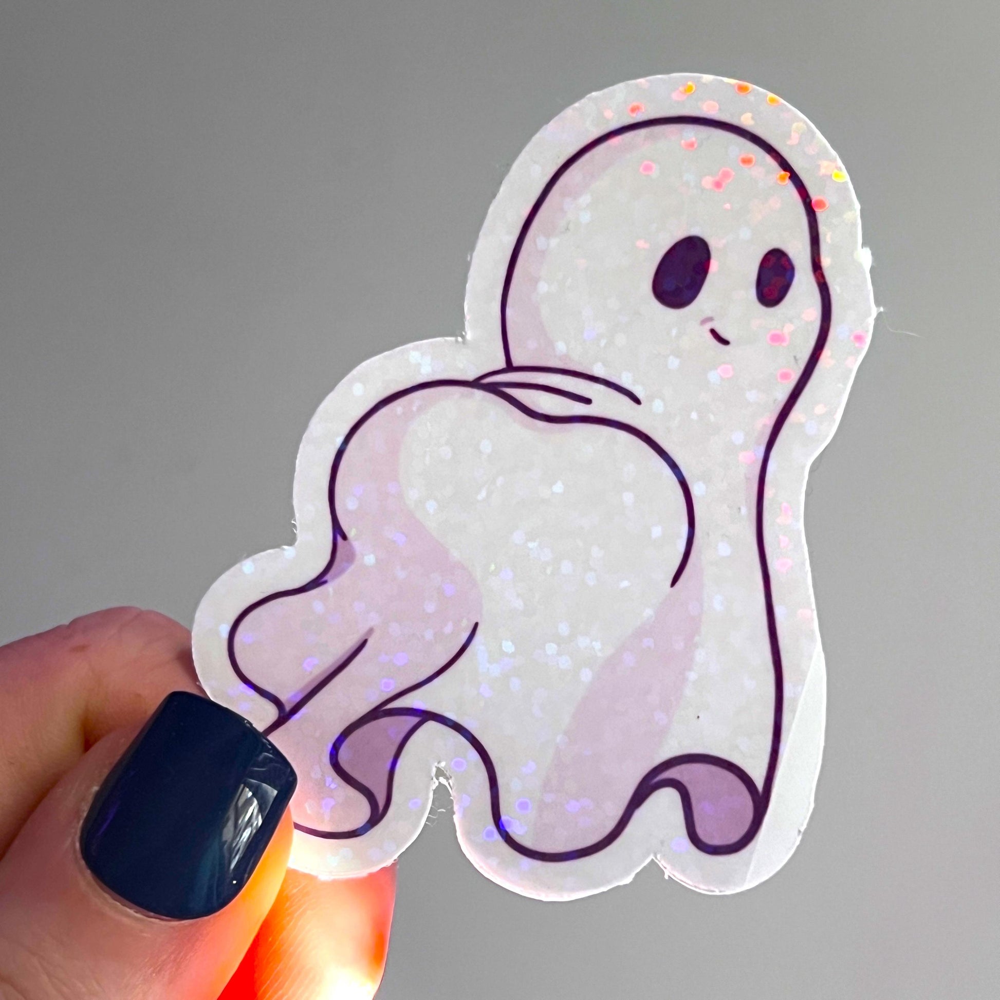 Holographic ghost sticker set featuring three adorable and sassy ghost designs. Perfect for decorating laptops, water bottles, or journals. Add a spooky yet cute touch to your accessories.