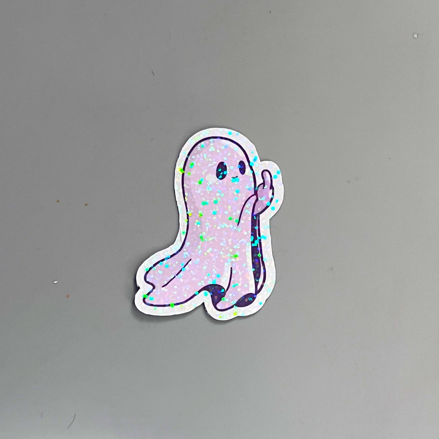 Holographic ghost sticker set featuring three adorable and sassy ghost designs. Perfect for decorating laptops, water bottles, or journals. Add a spooky yet cute touch to your accessories.